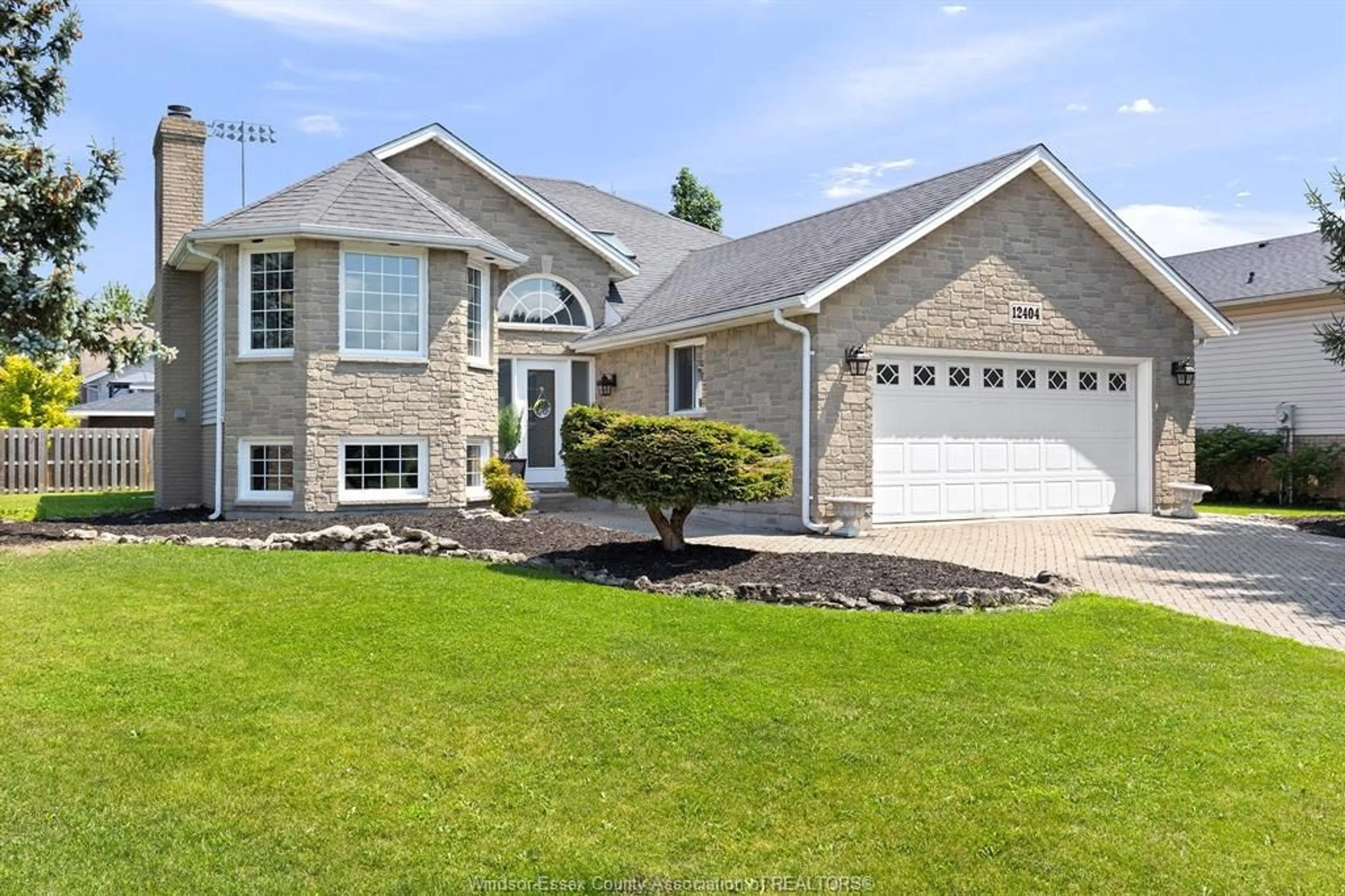 Home with vinyl exterior material, street for 12404 MEANDER, Tecumseh Ontario N8N 4P3