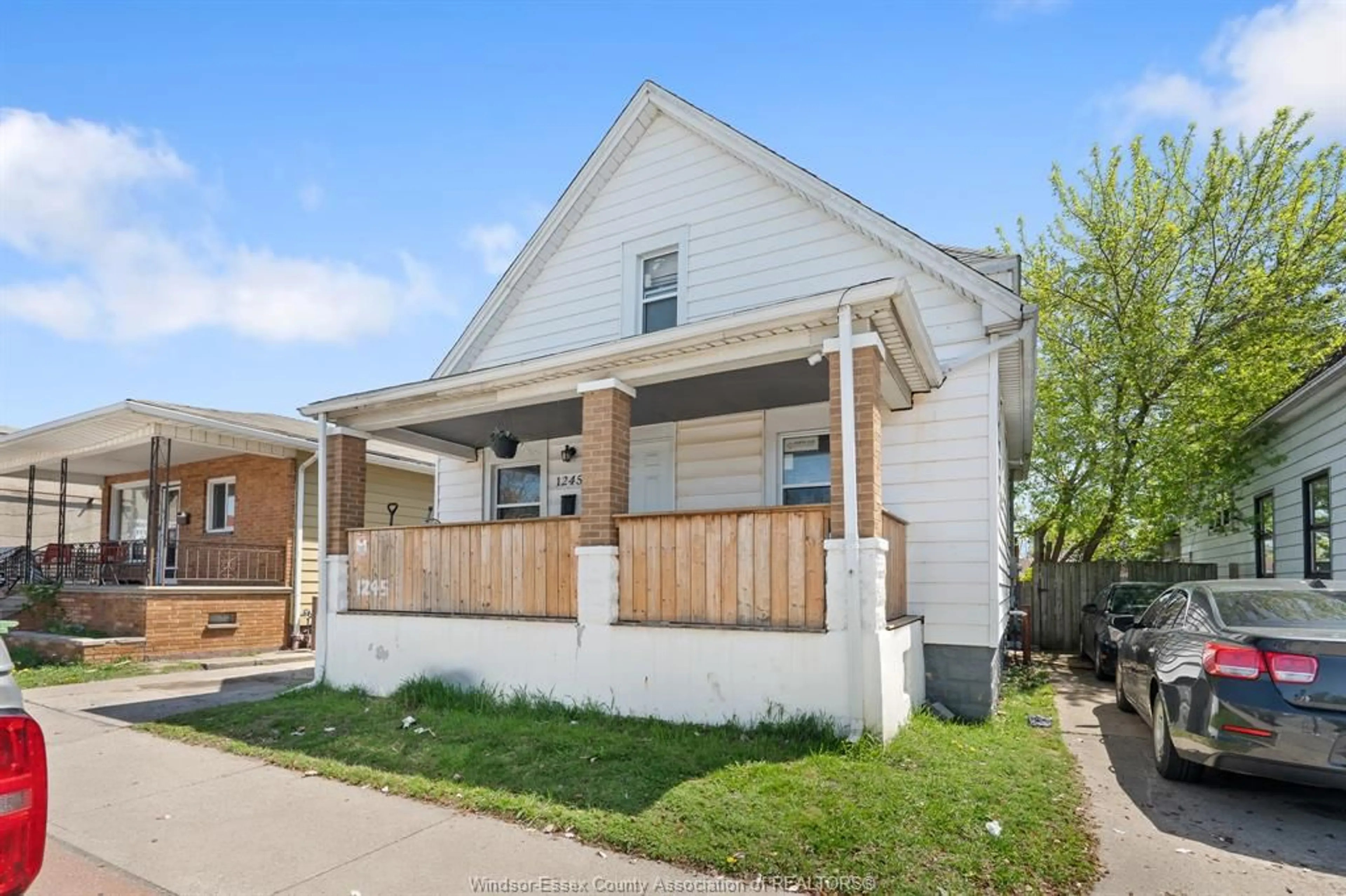 Home with vinyl exterior material, street for 1245 ERIE St, Windsor Ontario N9A 3Z6