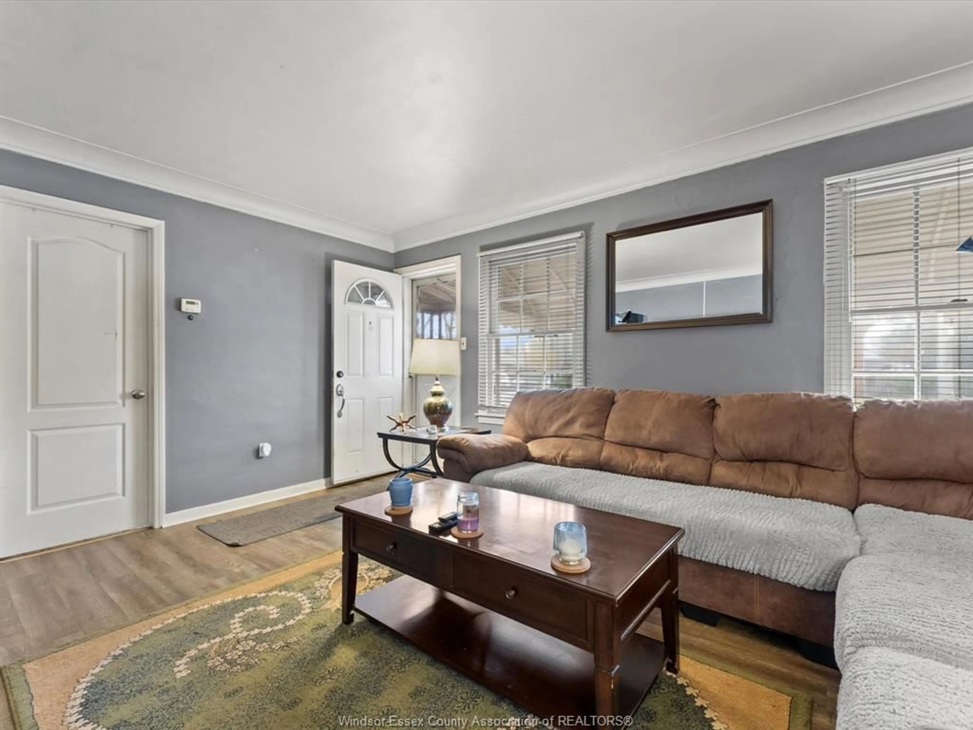Living room with furniture, wood/laminate floor for 1624 PRINCE Rd, Windsor Ontario N9C 3B7