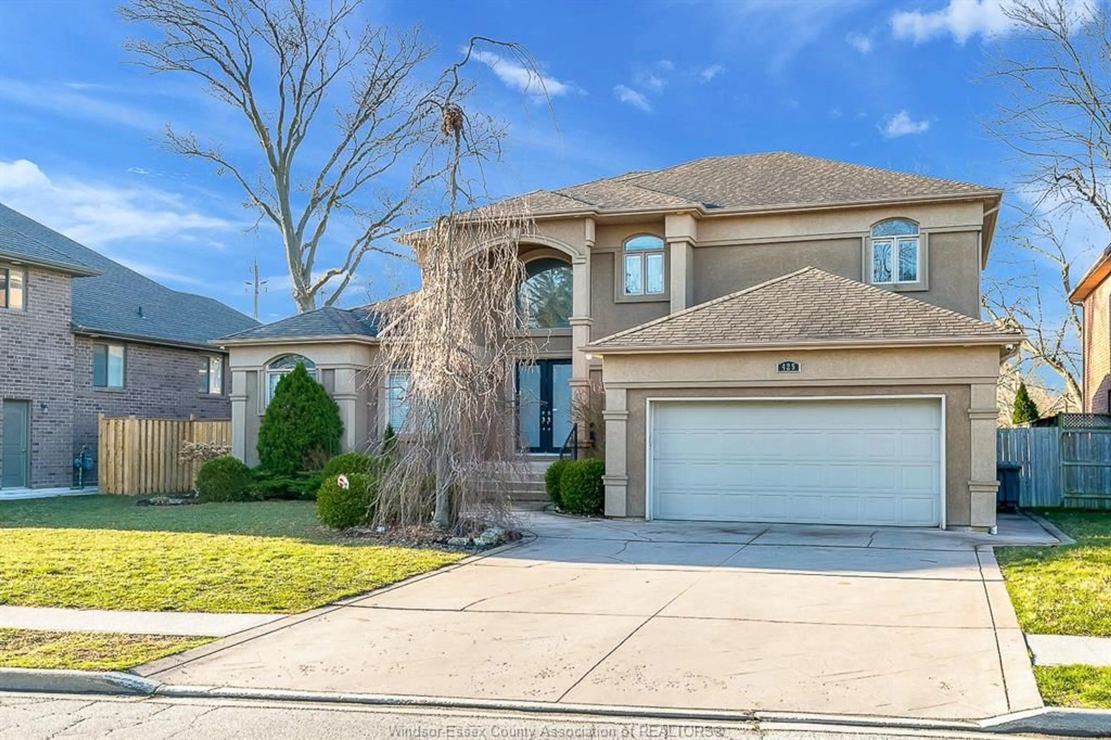 Home with brick exterior material, street for 425 COUNTRY CLUB Dr, Windsor Ontario N9G 3G9