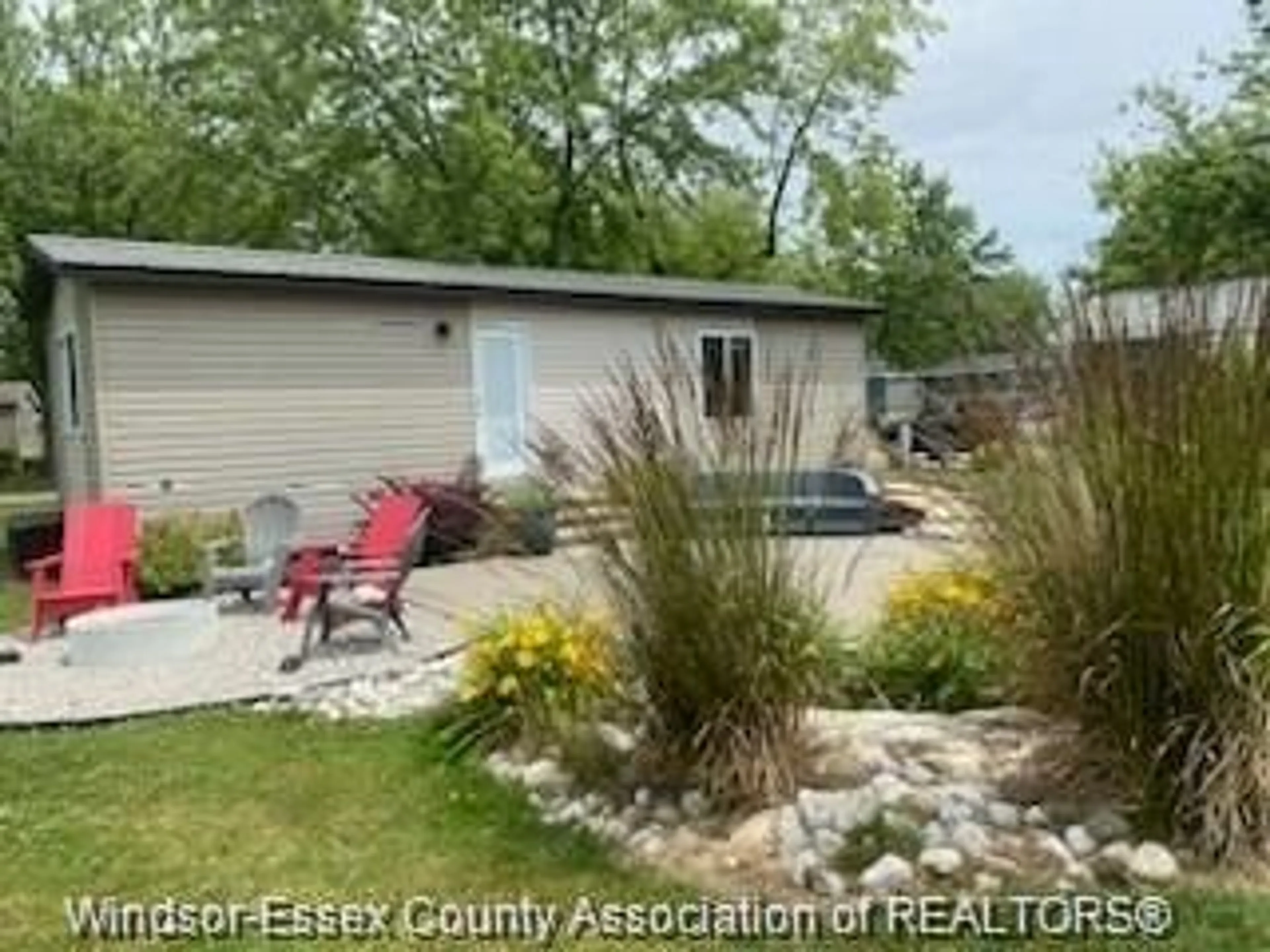 A pic from outside/outdoor area/front of a property/back of a property/a pic from drone, water/lake/river/ocean view for 981 COUNTY ROAD 2 #703, Lakeshore Ontario N0R 1A0