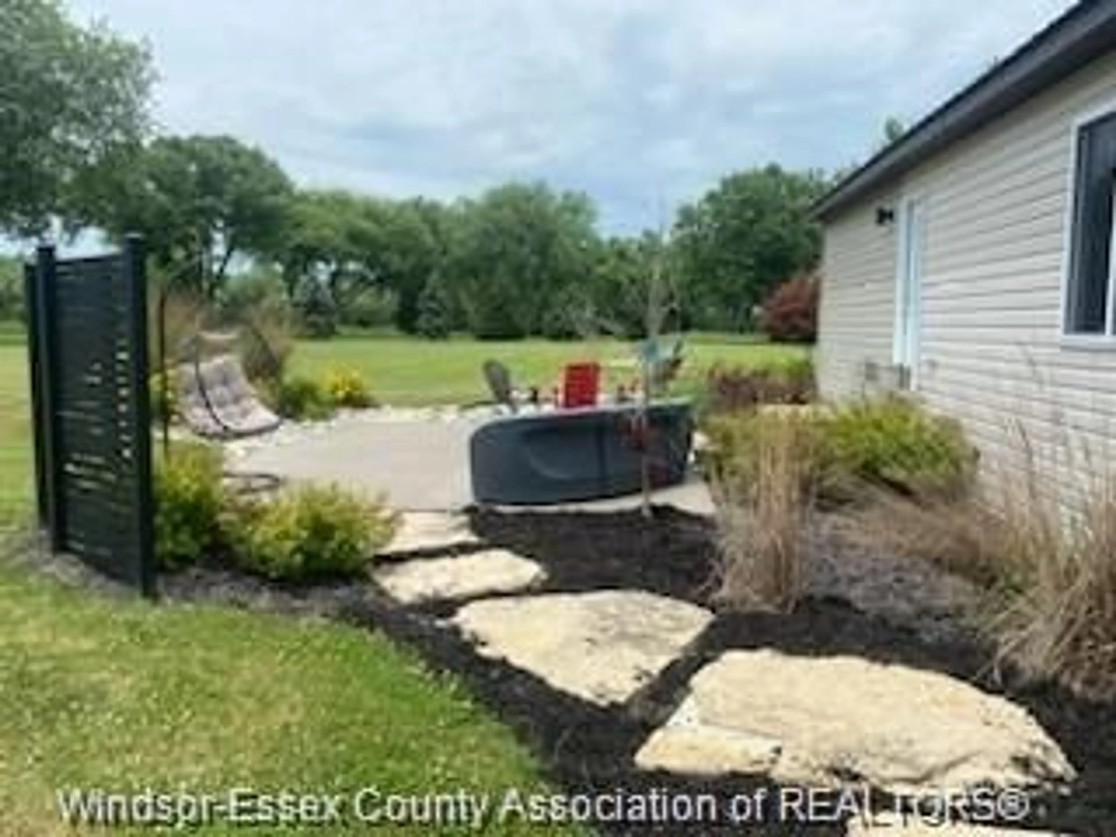A pic from outside/outdoor area/front of a property/back of a property/a pic from drone, water/lake/river/ocean view for 981 COUNTY ROAD 2 #703, Lakeshore Ontario N0R 1A0