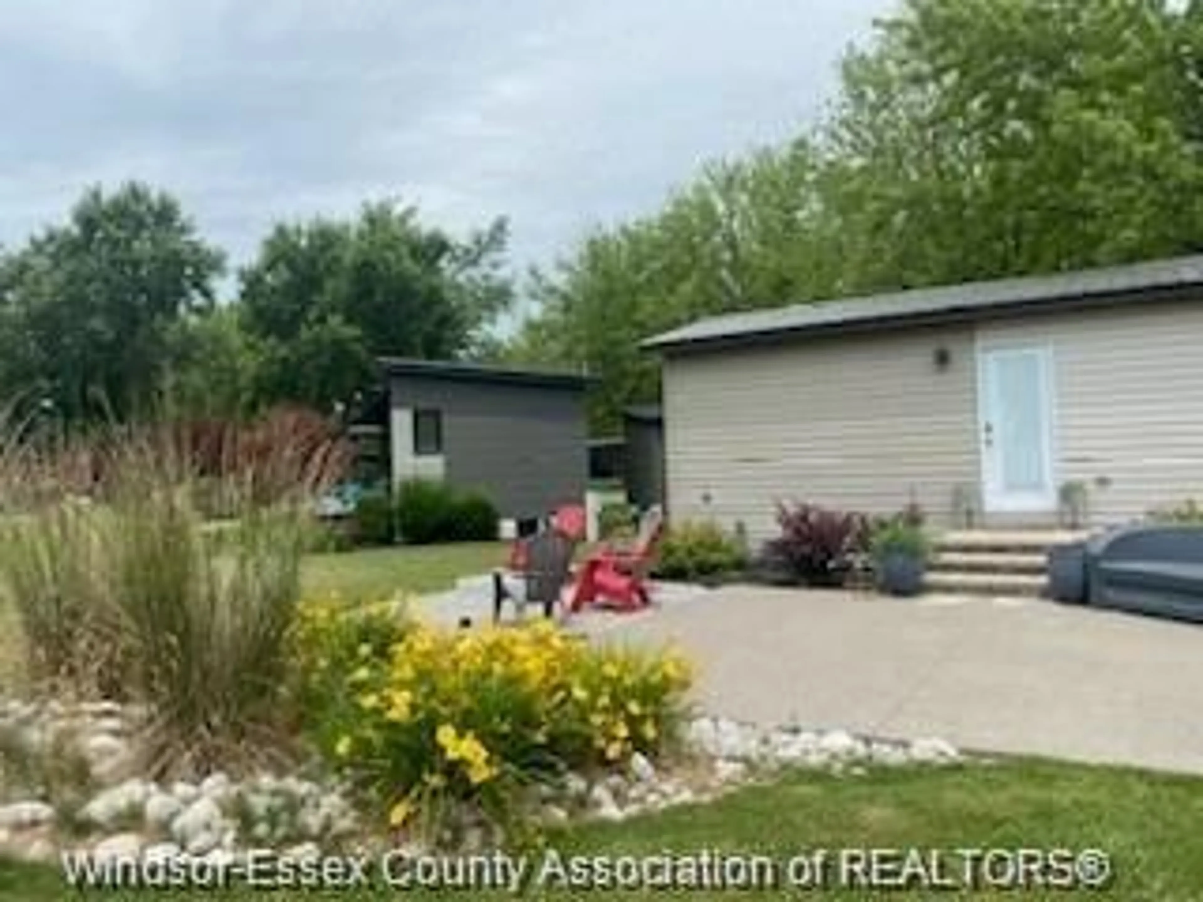 A pic from outside/outdoor area/front of a property/back of a property/a pic from drone, street for 981 COUNTY ROAD 2 #703, Lakeshore Ontario N0R 1A0