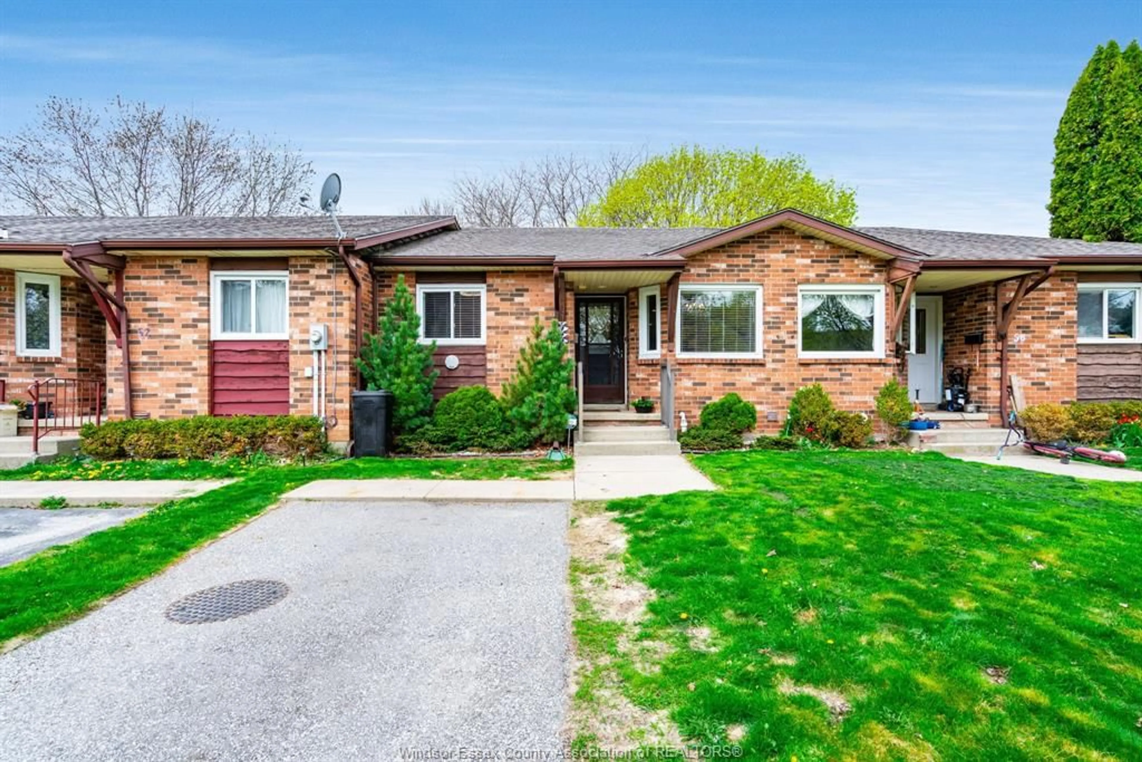 Home with brick exterior material, street for 54 REMARK Dr, Kingsville Ontario N9Y 3X6