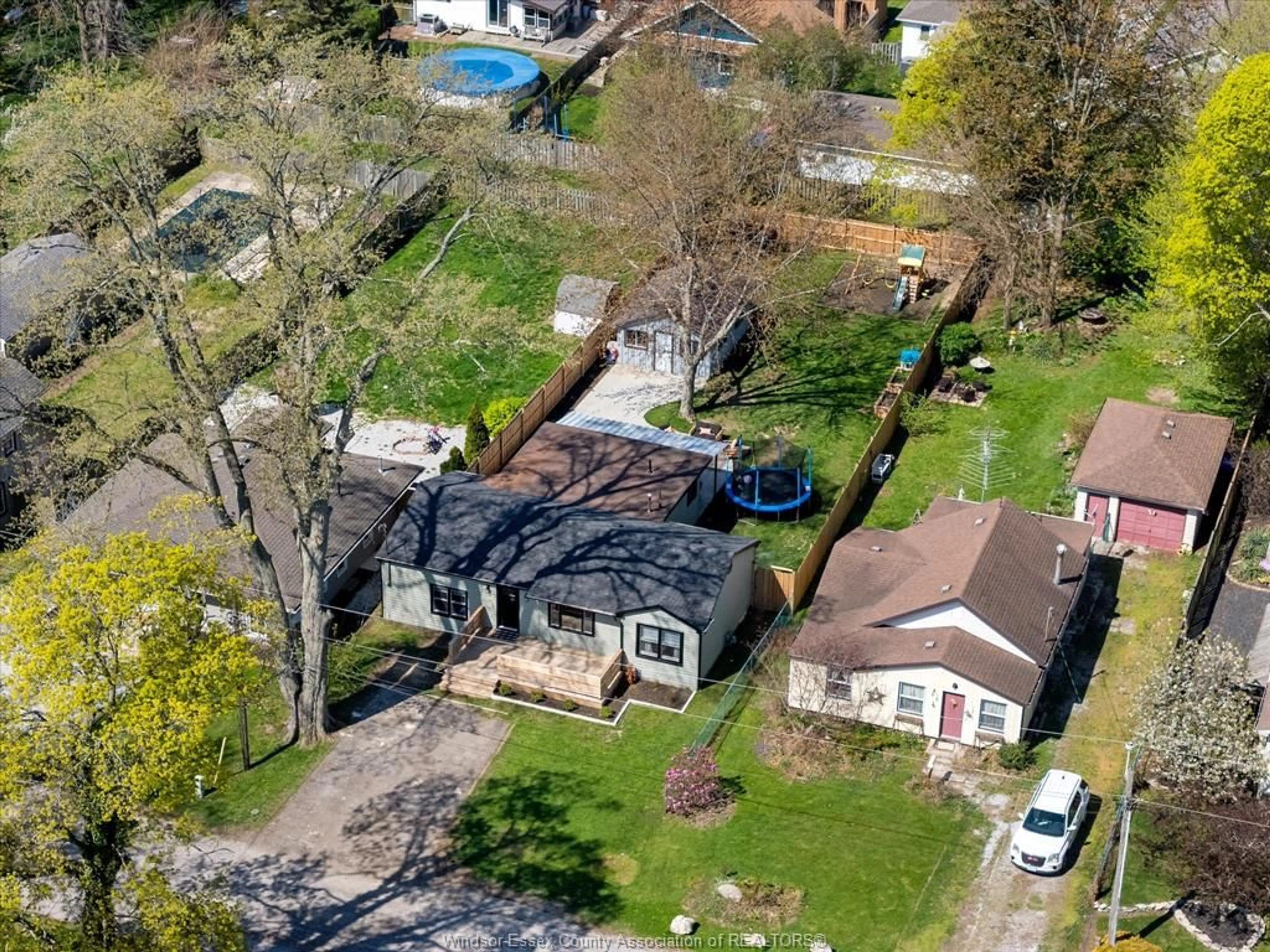 A pic from outside/outdoor area/front of a property/back of a property/a pic from drone, street for 1313 Torquay Dr, Kingsville Ontario N9Y 2P5