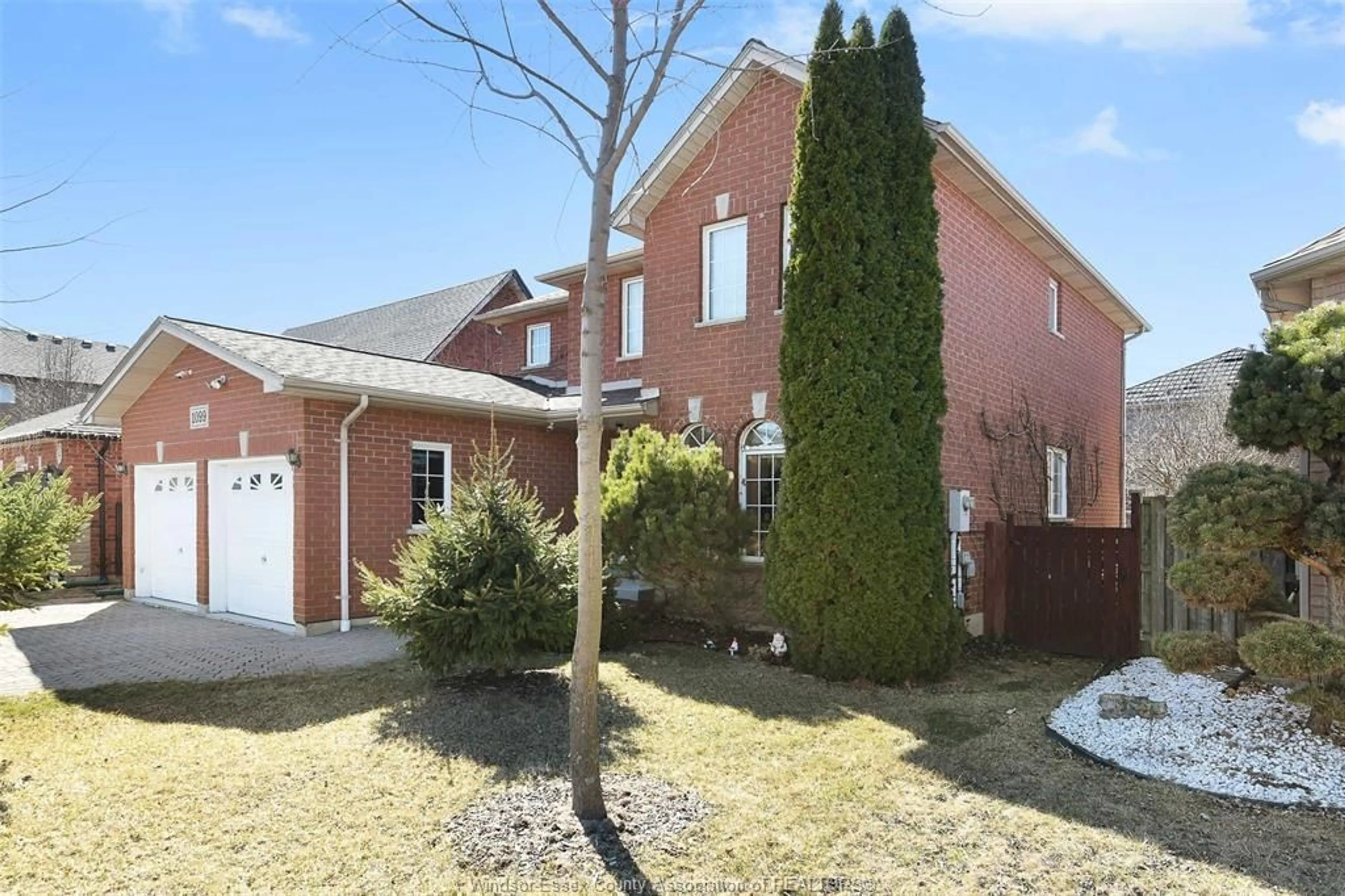 Home with brick exterior material, street for 1099 CORA GREENWOOD Dr, Windsor Ontario N8P 1K3