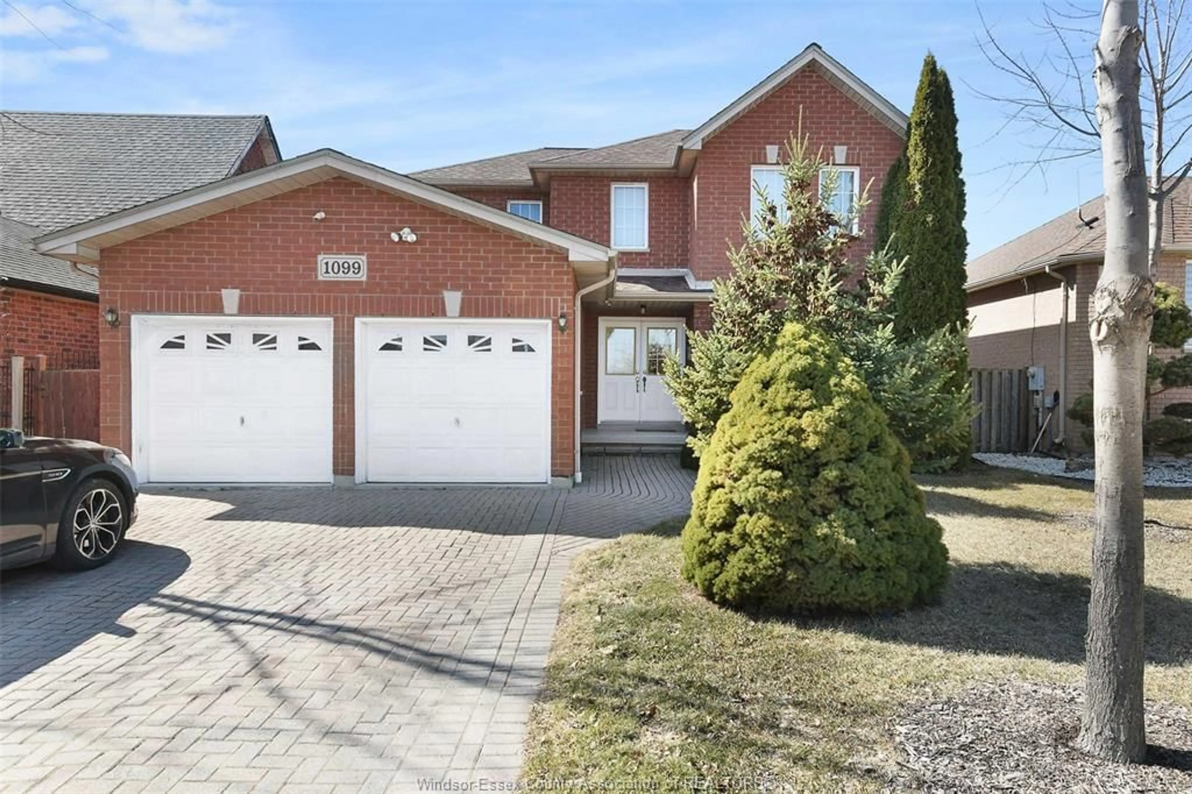 Home with brick exterior material, street for 1099 CORA GREENWOOD Dr, Windsor Ontario N8P 1K3
