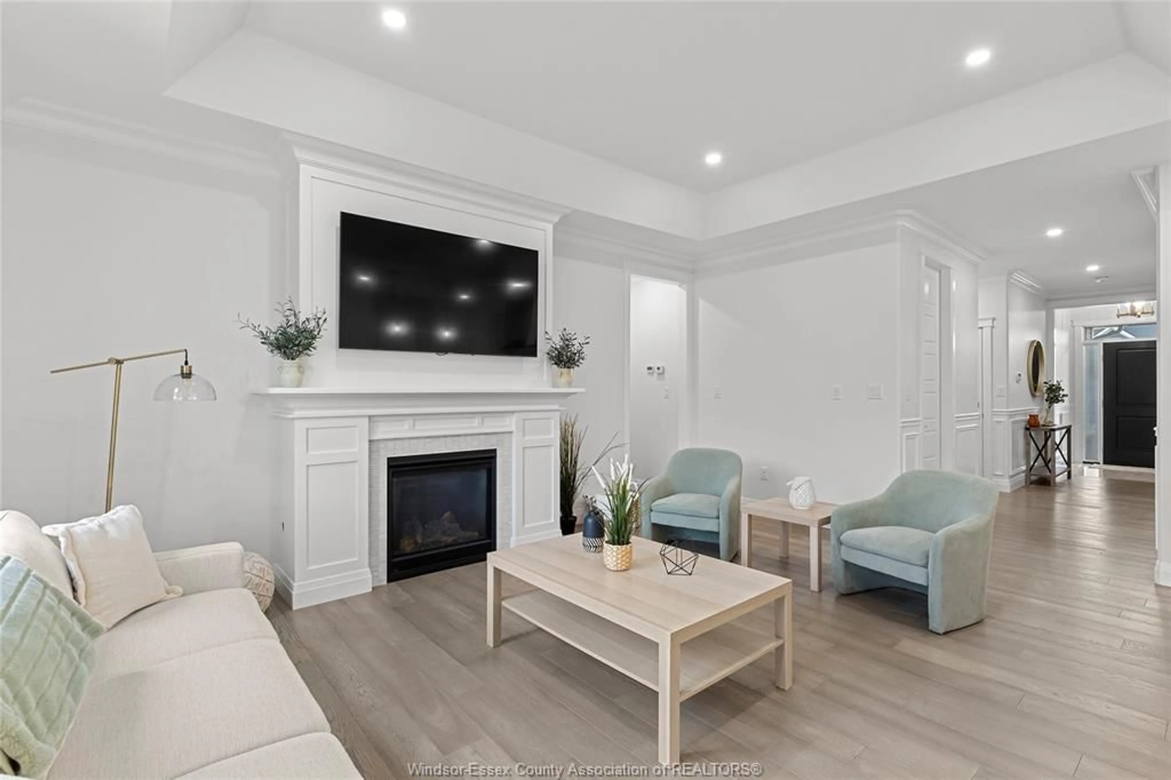 Living room with furniture, wood/laminate floor for 437 Brumar Cres, Lakeshore Ontario N0R 1A0