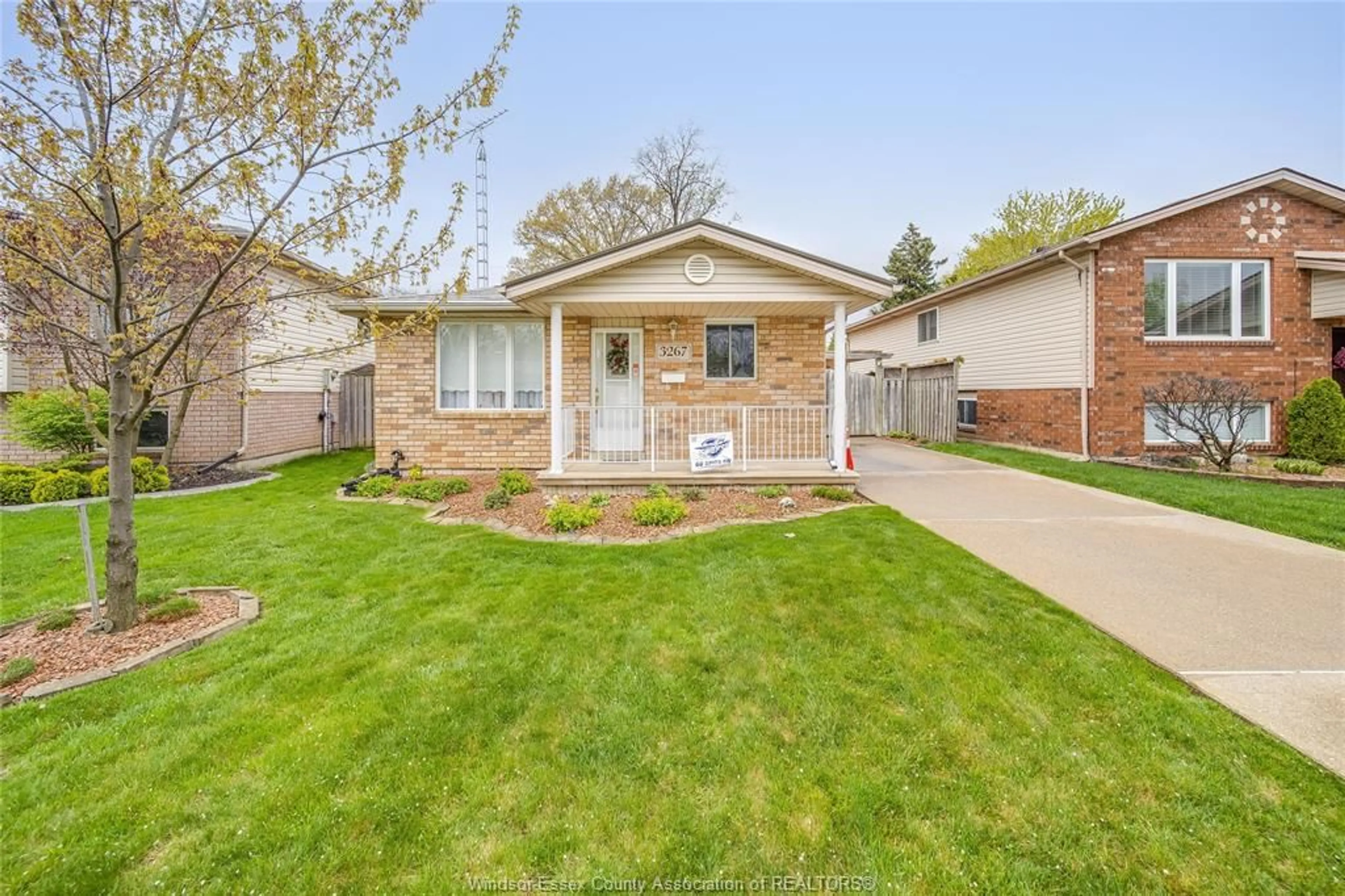 Home with brick exterior material, street for 3267 CONSERVATION Dr, Windsor Ontario N8W 5P2