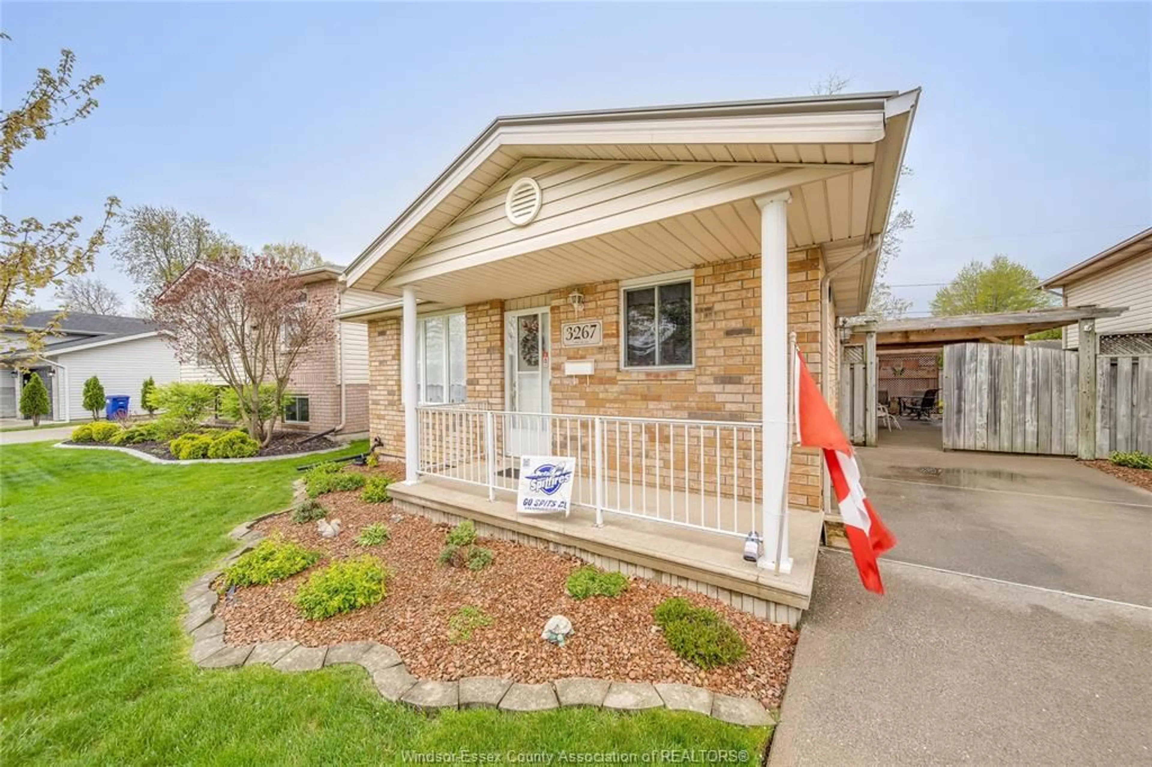 Home with brick exterior material, street for 3267 CONSERVATION Dr, Windsor Ontario N8W 5P2