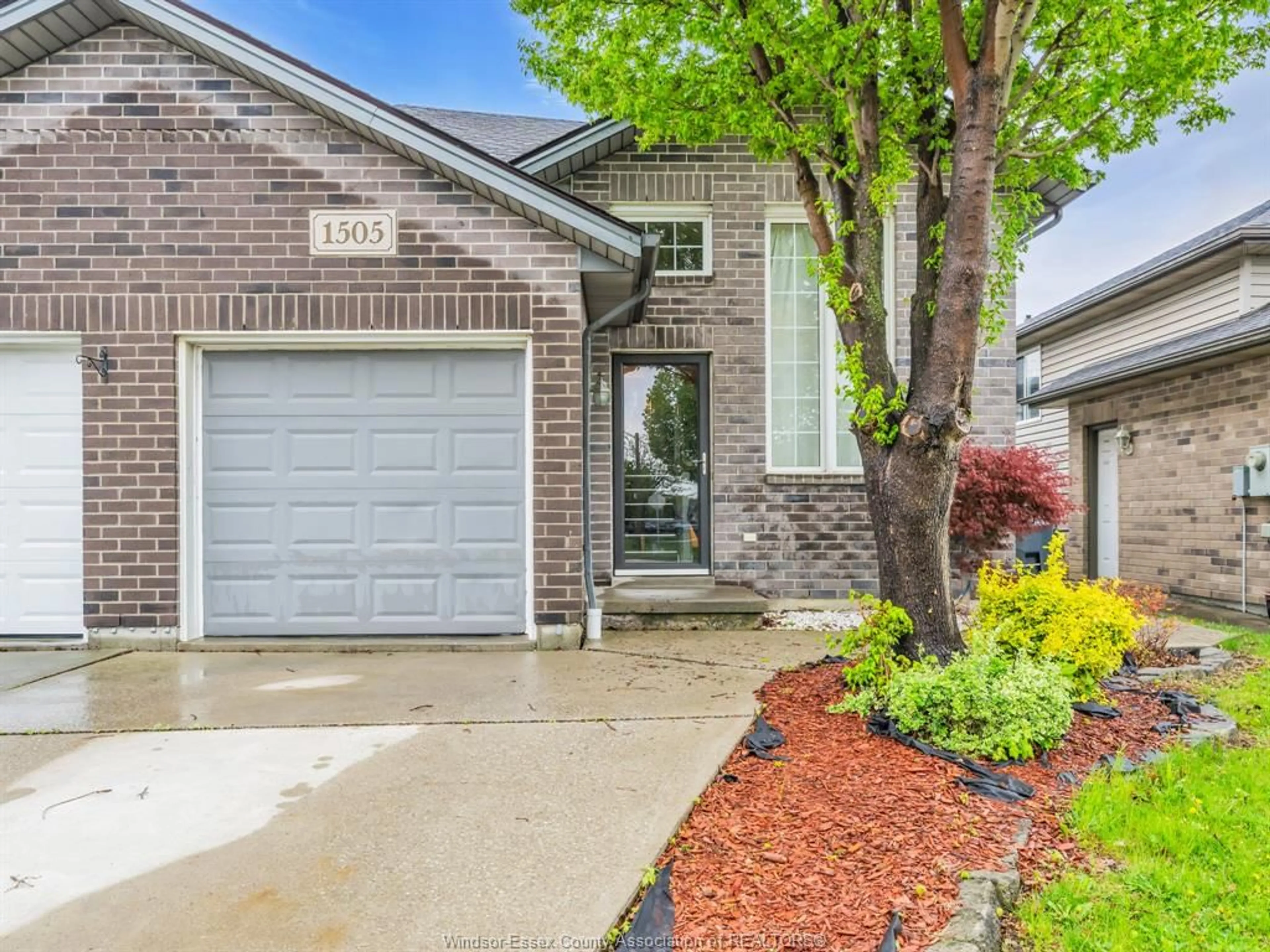 Home with brick exterior material, street for 1505 HIGHNOON Dr, Windsor Ontario N9G 3B6