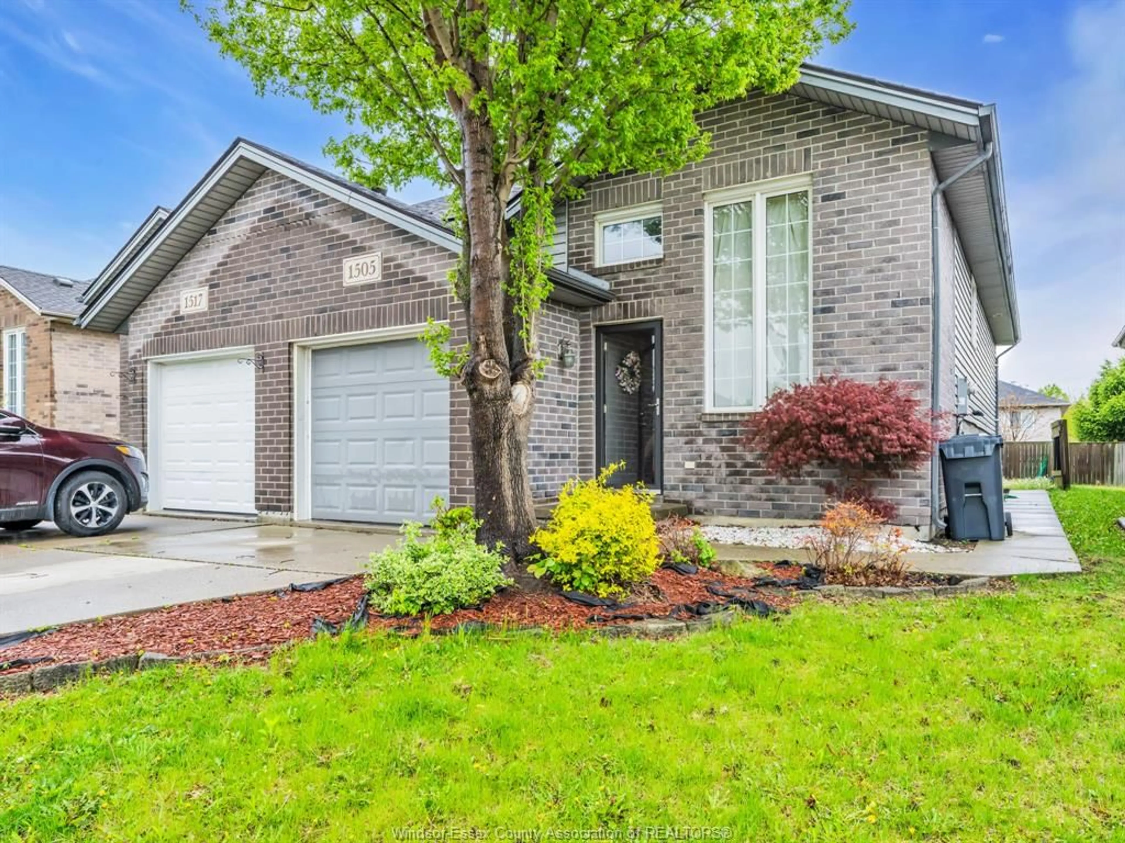 Home with brick exterior material, street for 1505 HIGHNOON Dr, Windsor Ontario N9G 3B6