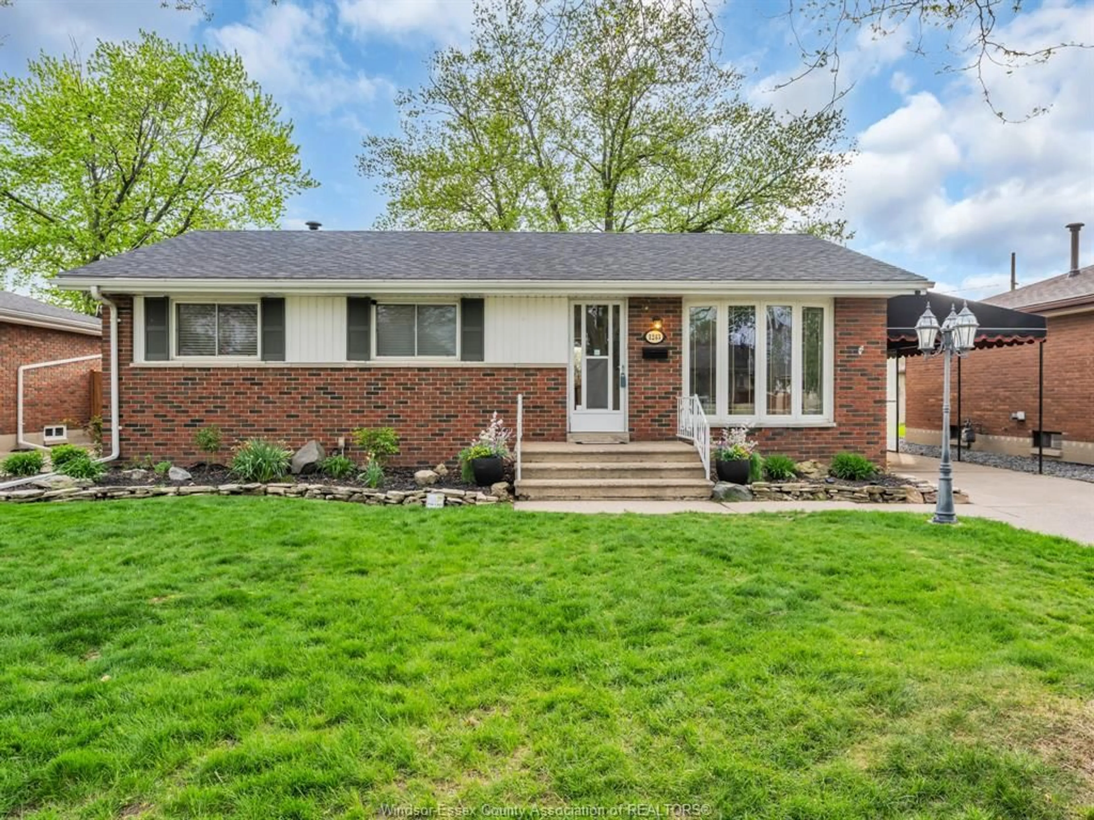 Home with brick exterior material, street for 1243 JANISSE Dr, Windsor Ontario N8S 2W2
