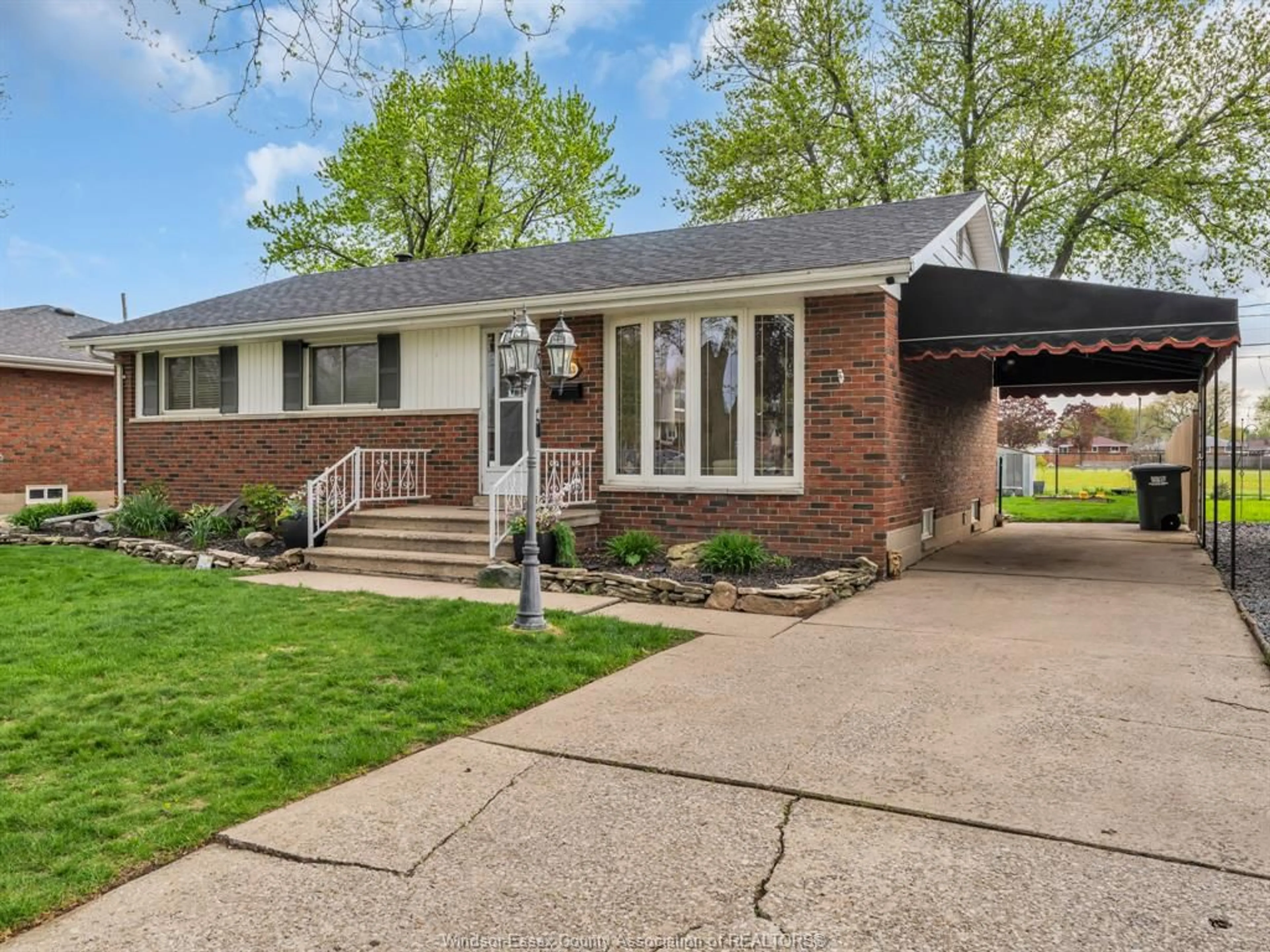 Home with brick exterior material, street for 1243 JANISSE Dr, Windsor Ontario N8S 2W2