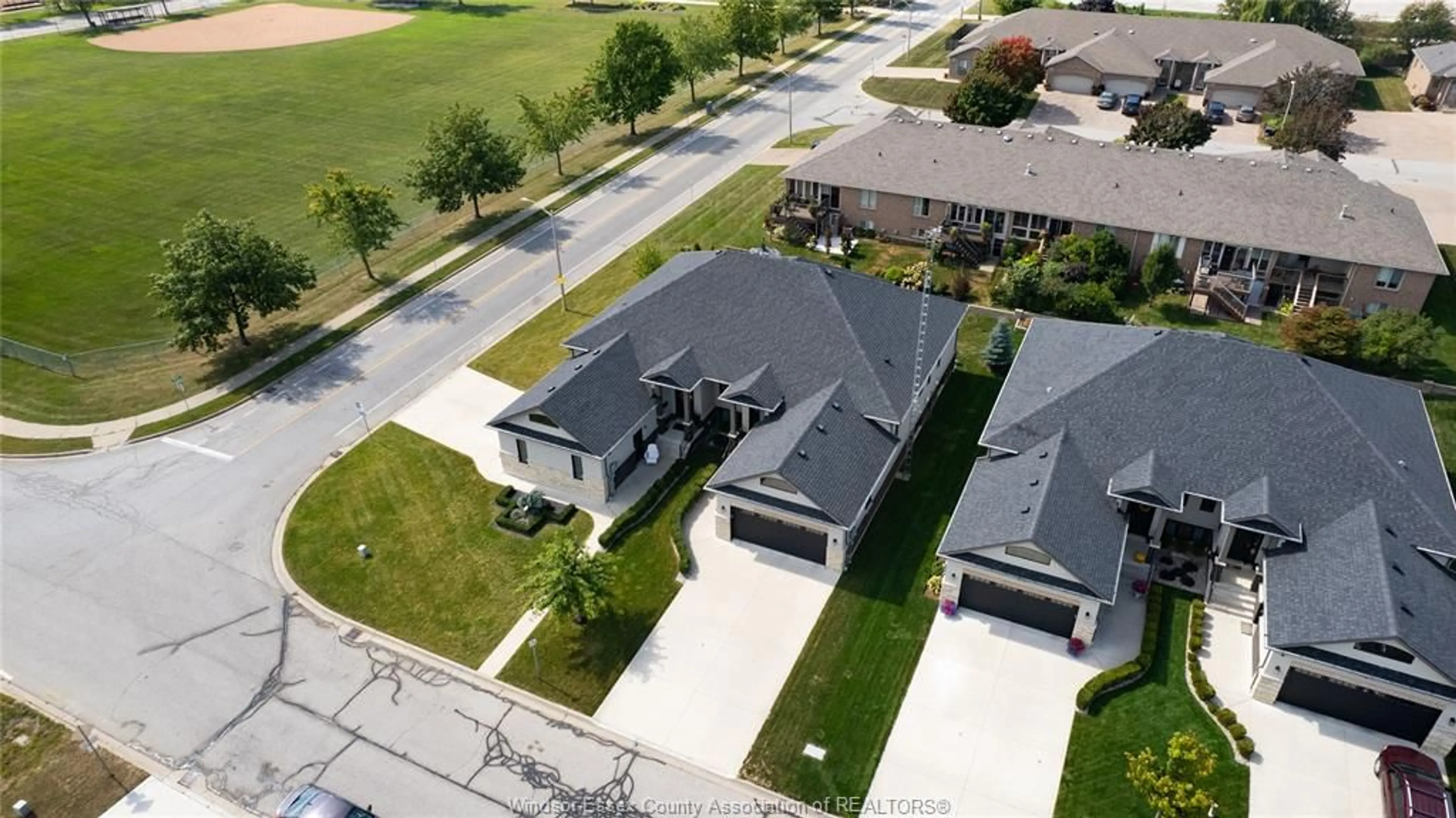 A pic from outside/outdoor area/front of a property/back of a property/a pic from drone, street for 97 CAROLINA WOODS Cres, Leamington Ontario N8H 5N2
