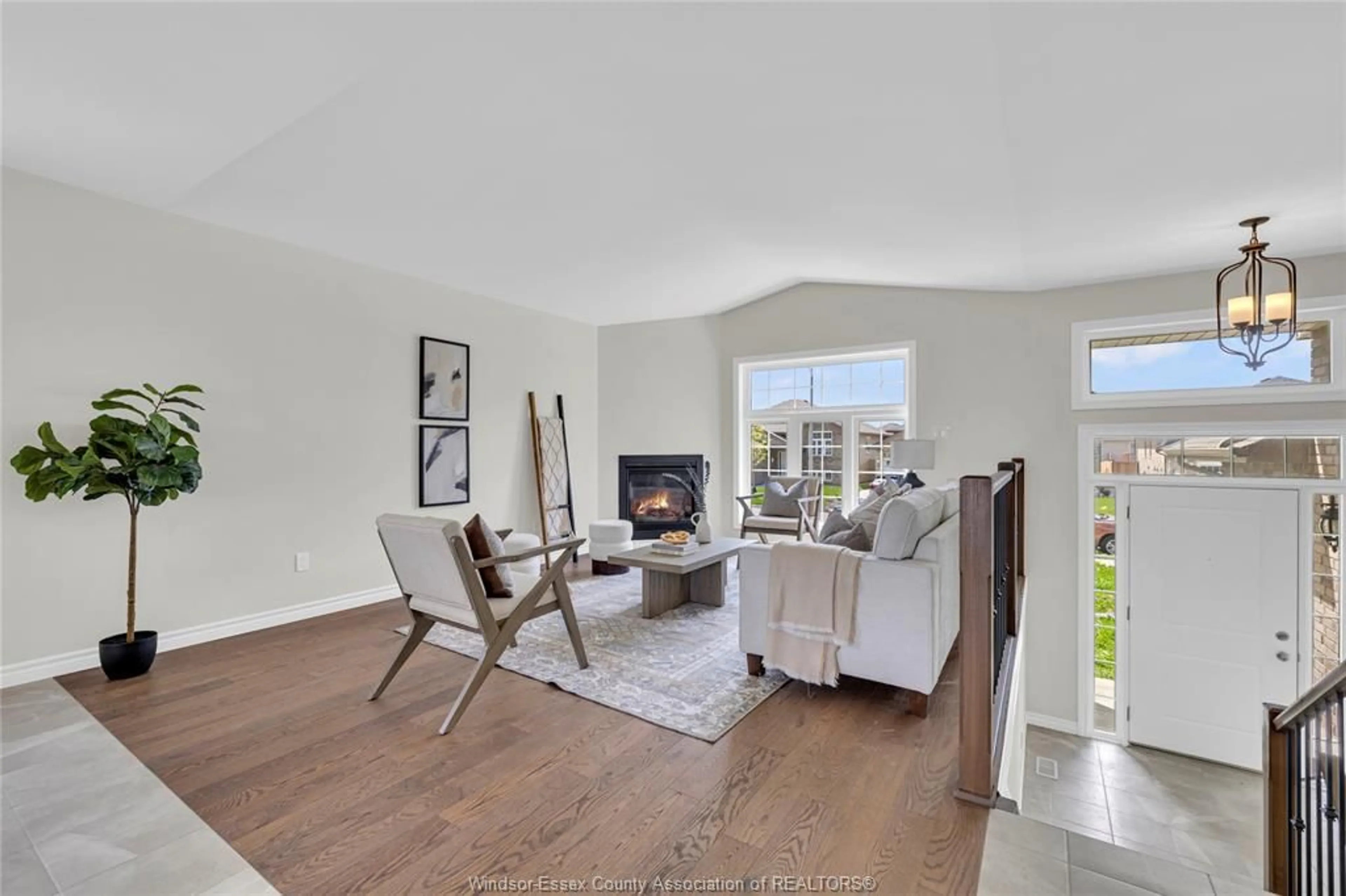 Living room with furniture, wood/laminate floor for 1052 LUBLIN Ave, Windsor Ontario N8P 035