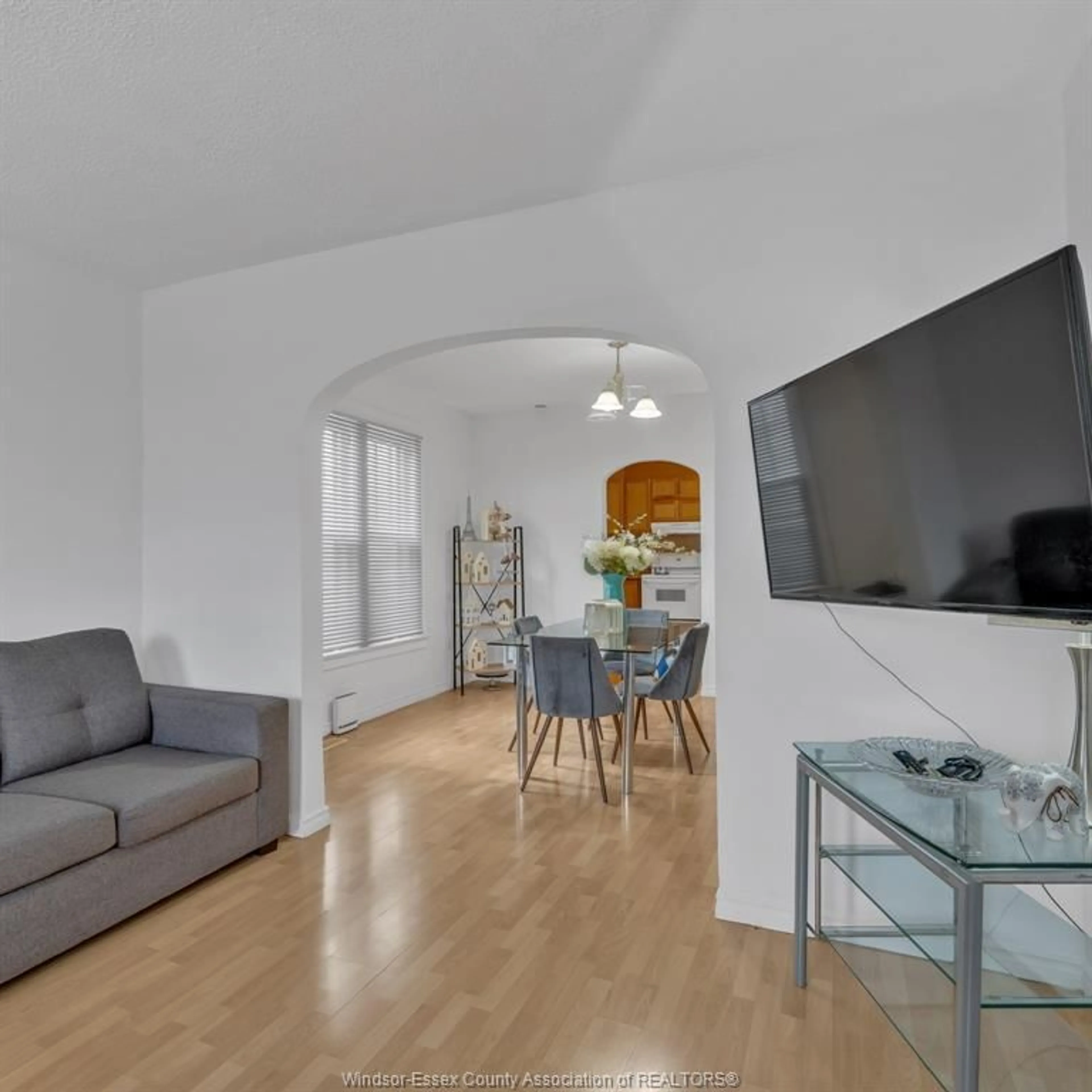 Living room with furniture, wood/laminate floor for 1443 GOYEAU St, Windsor Ontario N8X 3L2