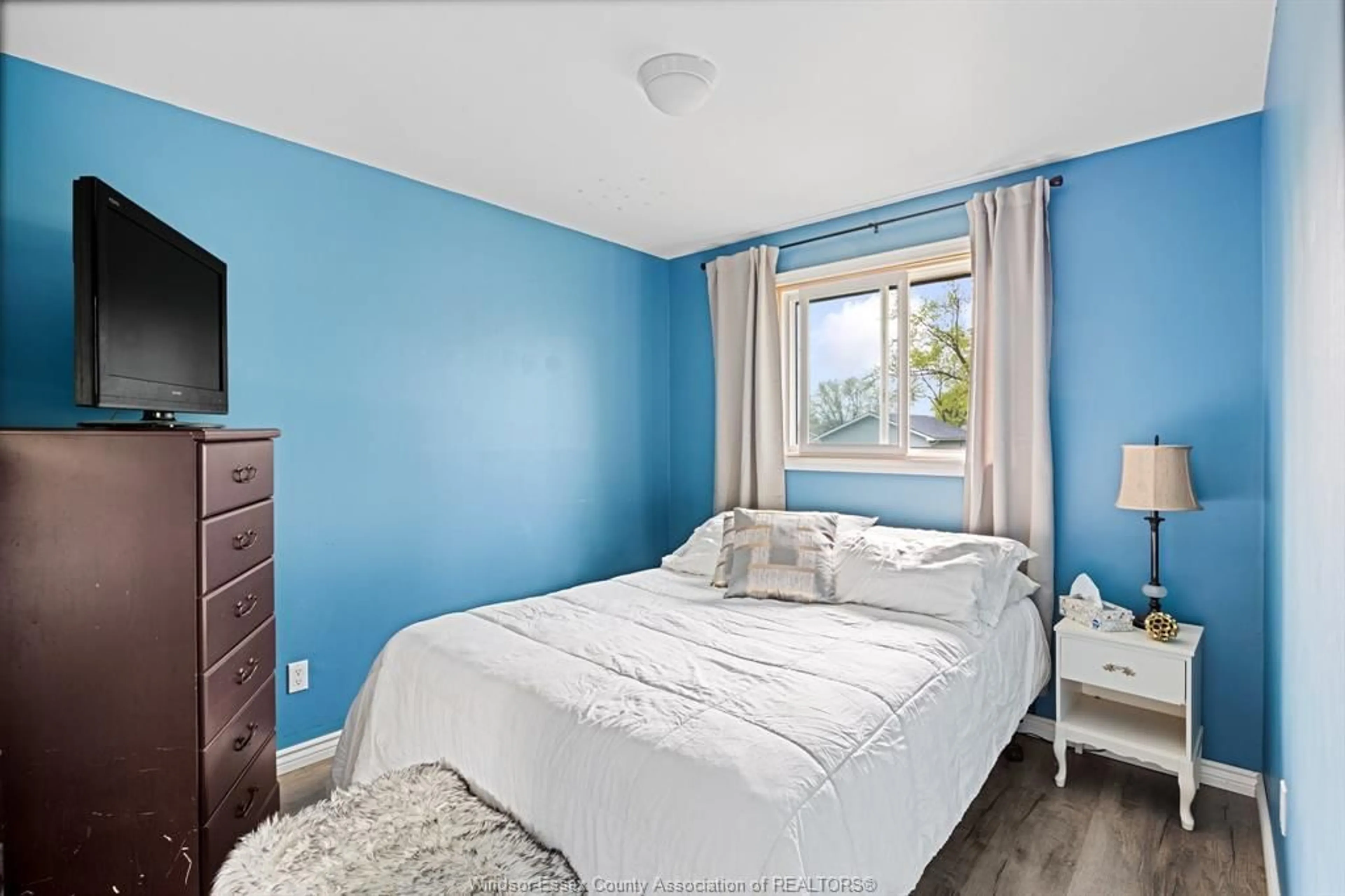 Bedroom with bed, wood/laminate floor for 157 ROYAL Cres, Lakeshore Ontario N0R 1A0