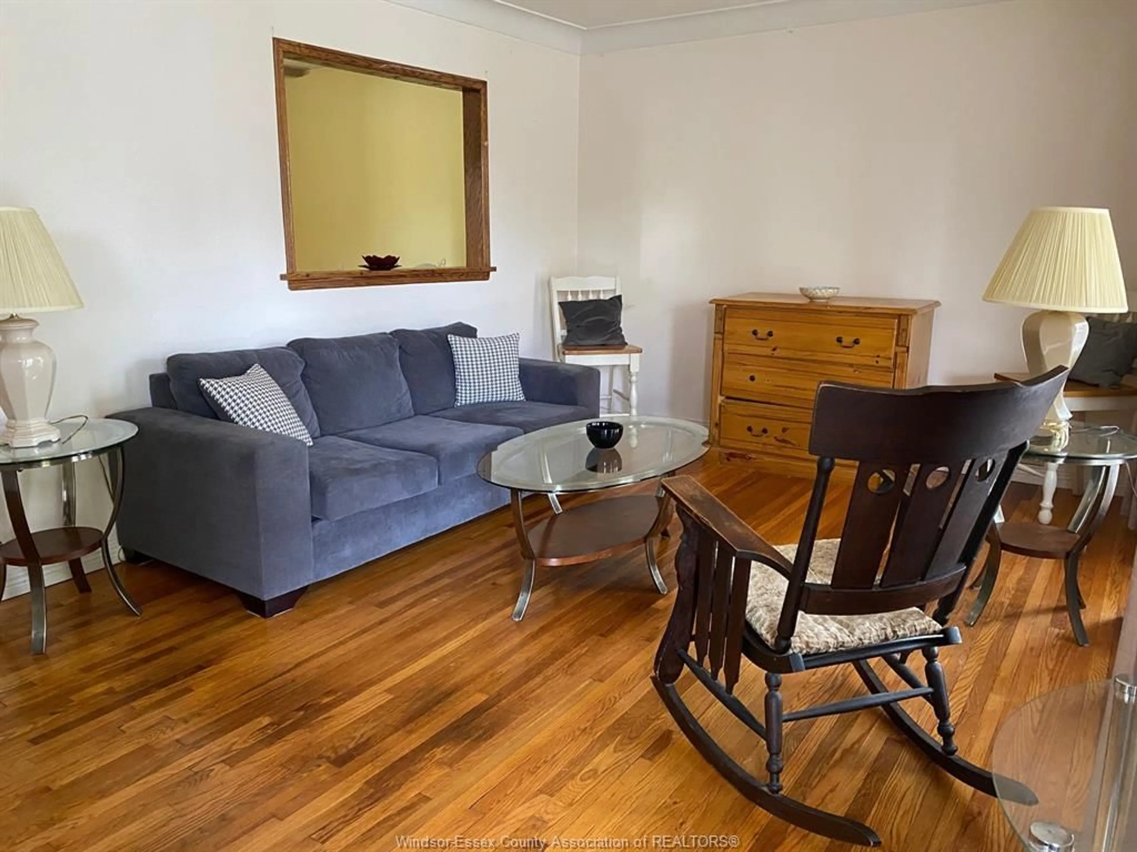 Living room with furniture, wood/laminate floor for 977 CURRY Ave, Windsor Ontario N9B 2C4