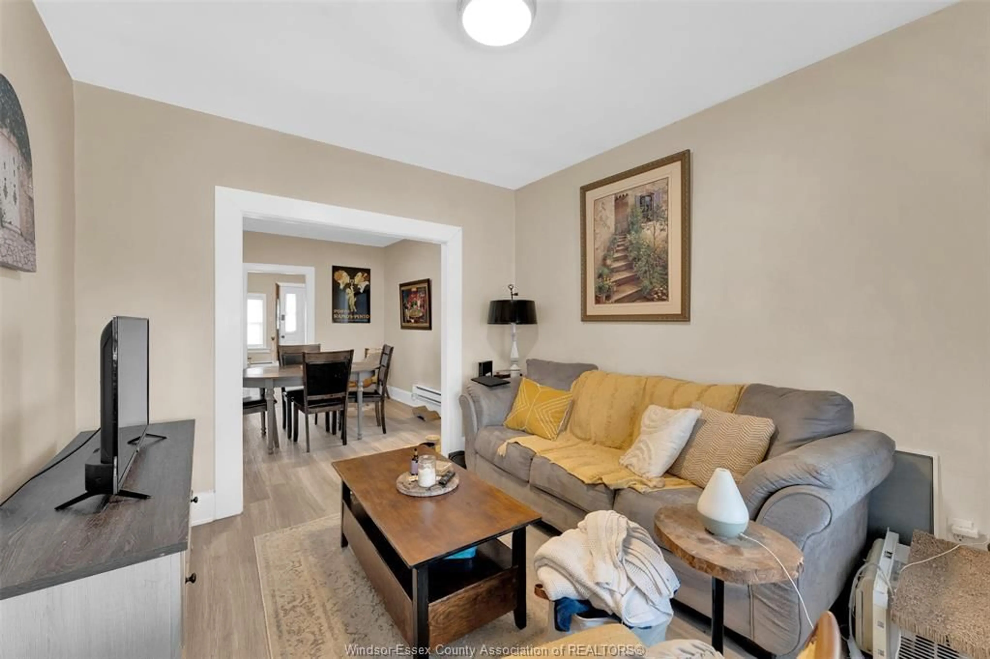 Living room with furniture, wood/laminate floor for 839-841 LANGLOIS, Windsor Ontario N9A 2G9