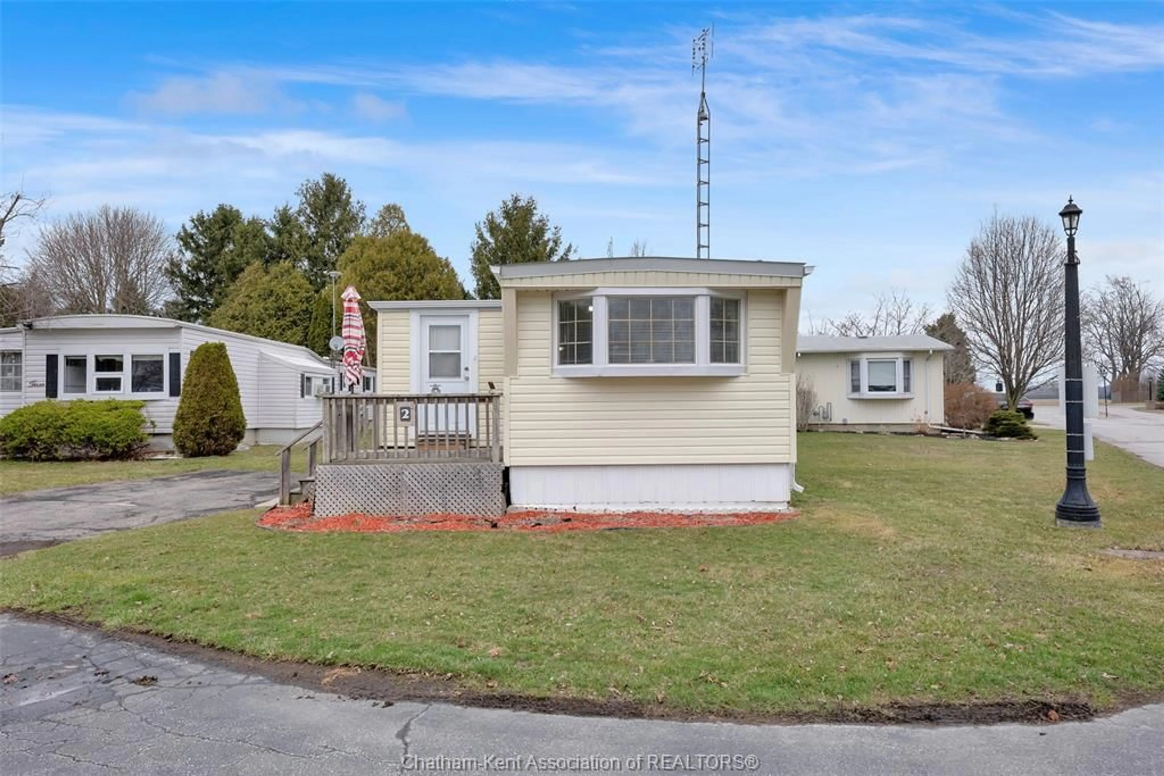 Home with vinyl exterior material, street for 22220 CHARING CROSS Rd #2, Chatham Ontario N7M 5V8