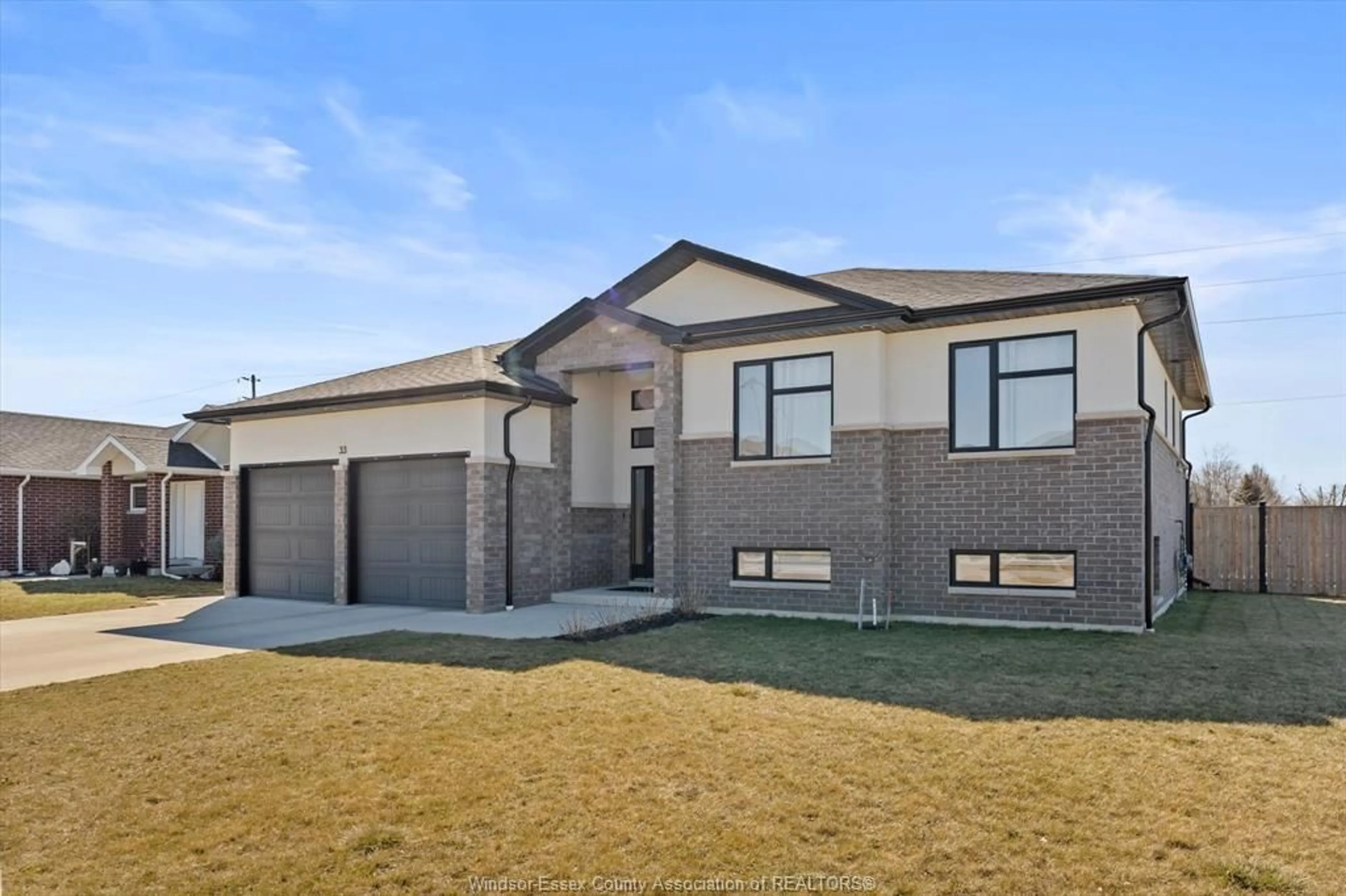 Home with brick exterior material, street for 33 SUNNINGDALE Dr, Leamington Ontario N8H 0C4
