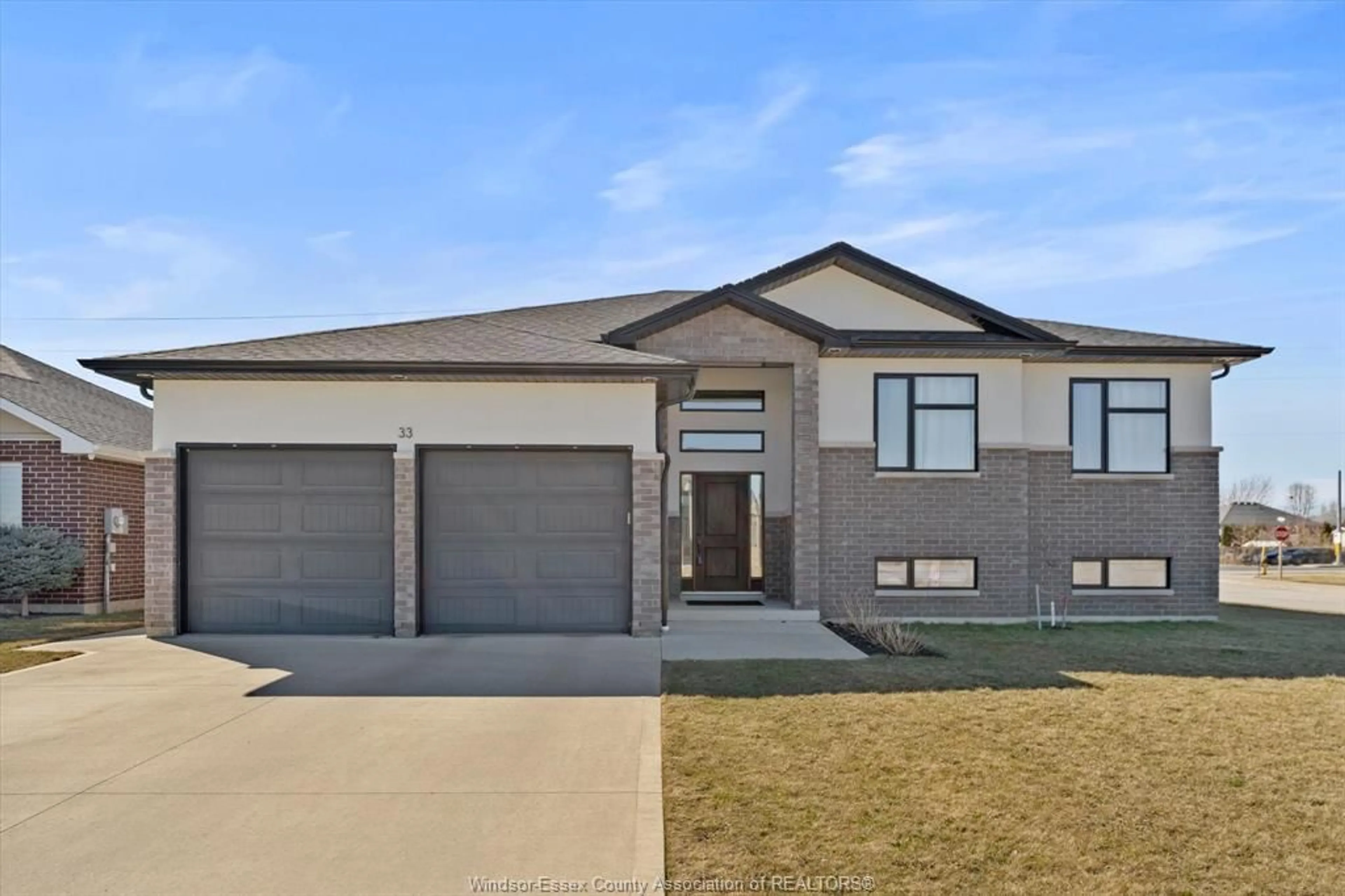 Home with brick exterior material, street for 33 SUNNINGDALE Dr, Leamington Ontario N8H 0C4