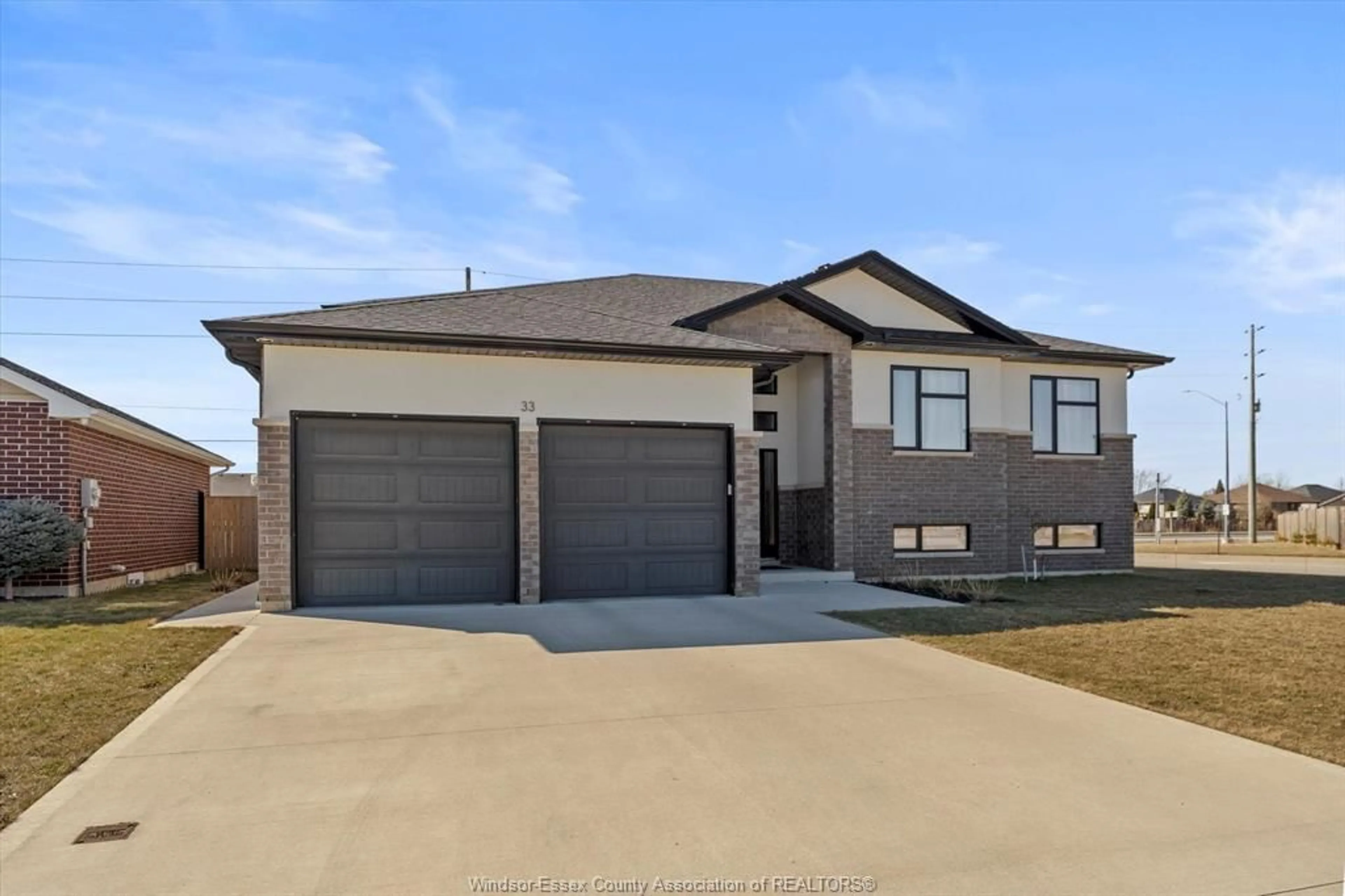 Home with brick exterior material, street for 33 SUNNINGDALE Dr, Leamington Ontario N8H 0C4