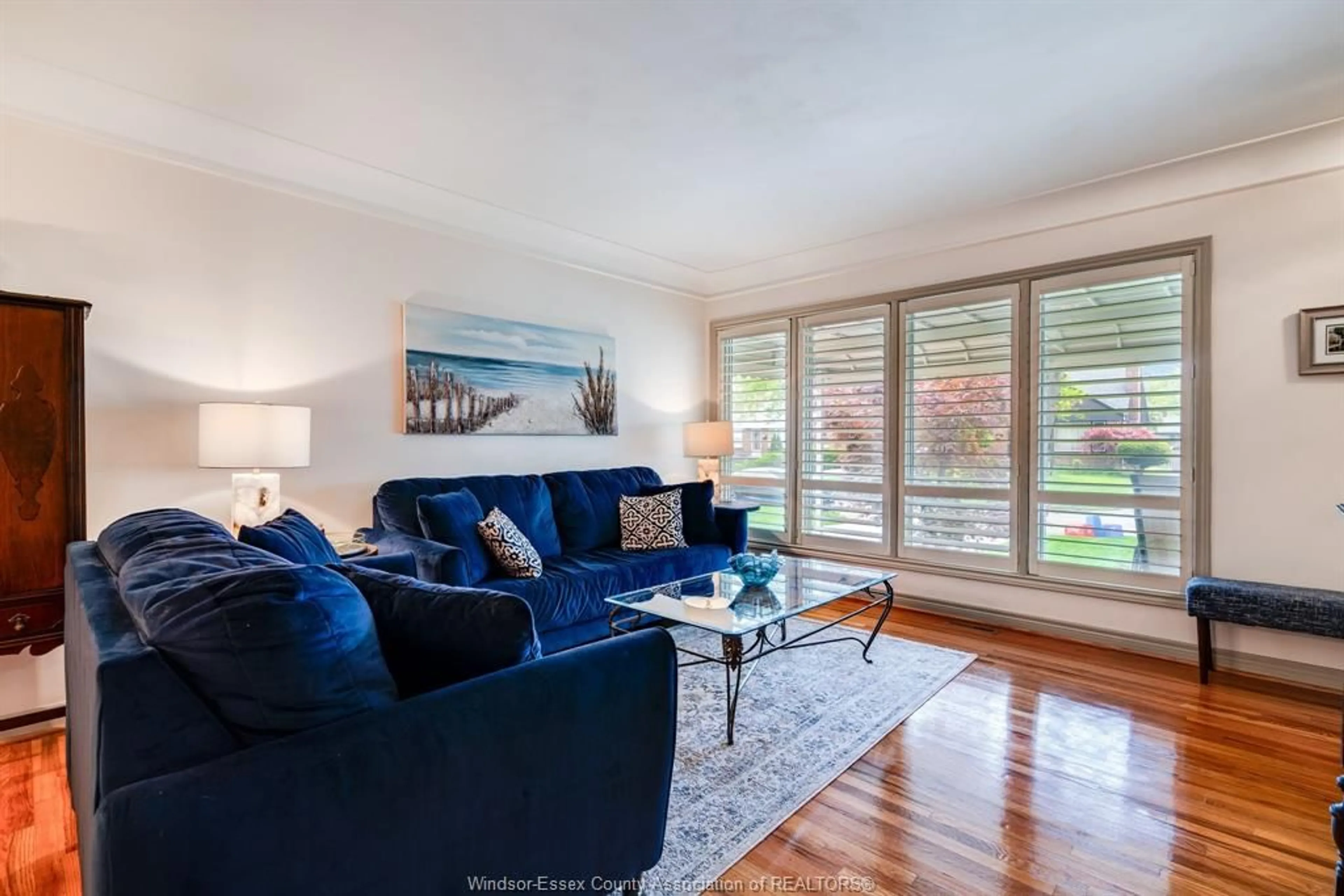 Living room with furniture, wood/laminate floor for 3025 RADISSON Ave, Windsor Ontario N9E 1Y4