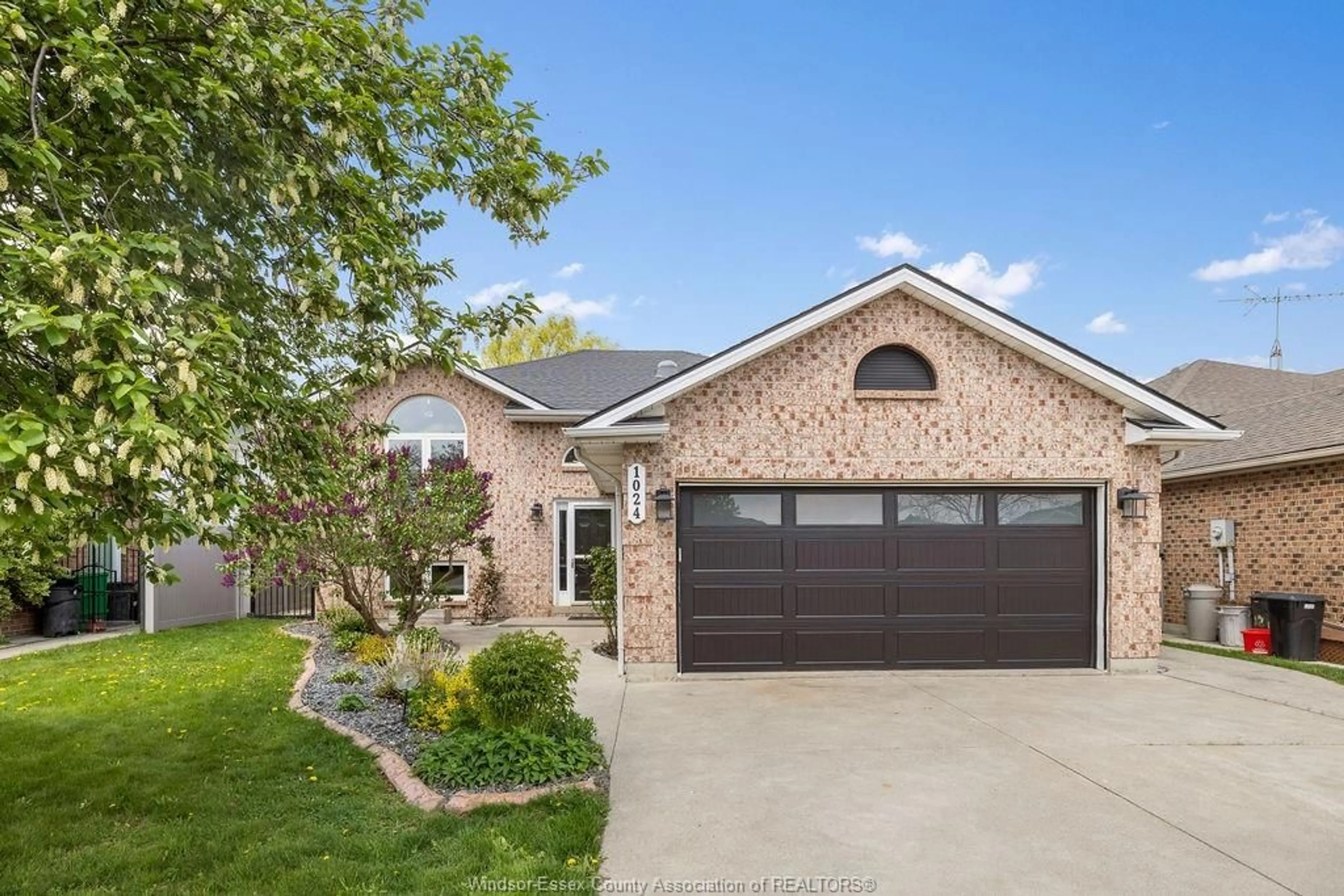 Home with brick exterior material, street for 1024 MONARCH MEADOWS Dr, Lakeshore Ontario N0R 1A0