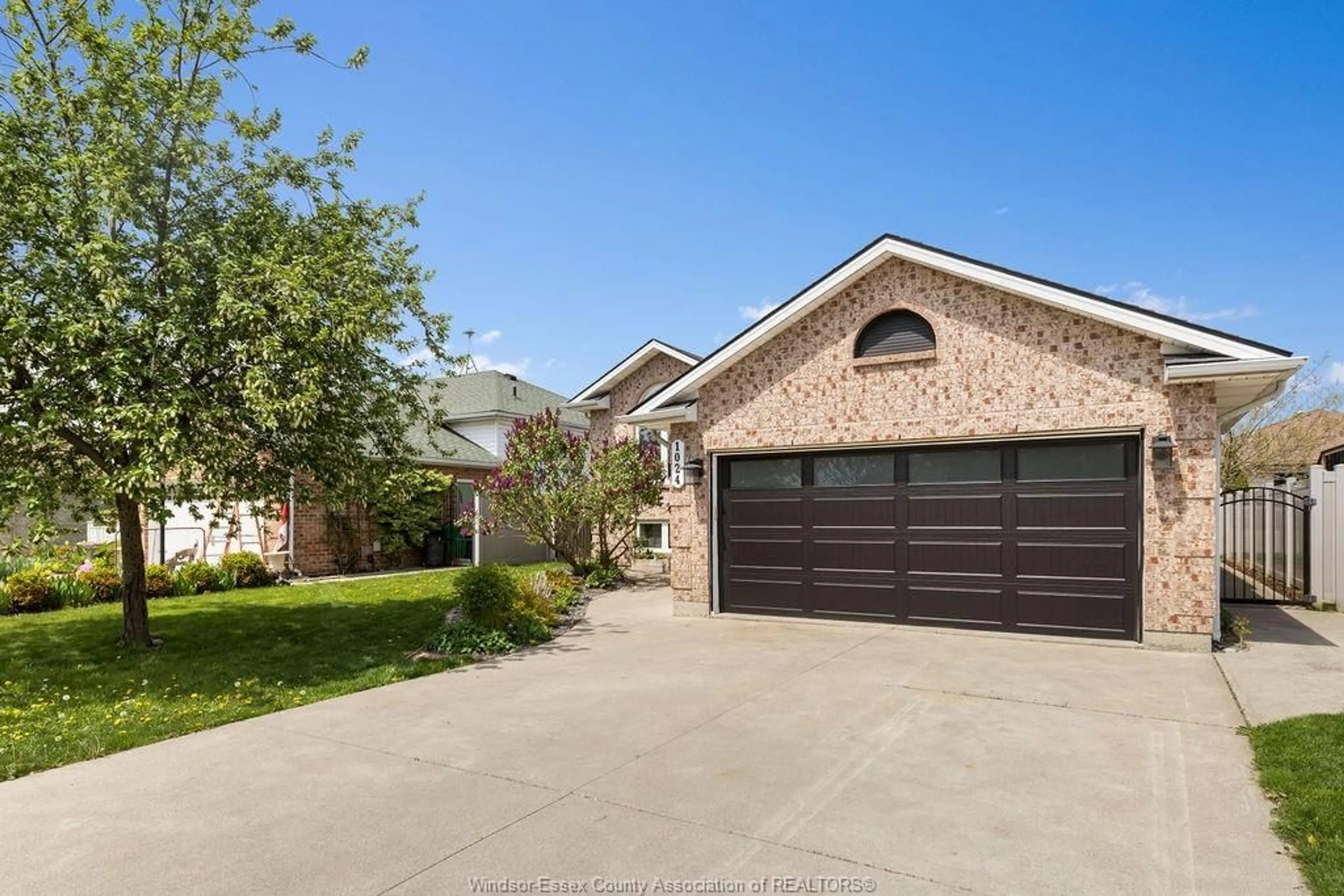 Home with brick exterior material, street for 1024 MONARCH MEADOWS Dr, Lakeshore Ontario N0R 1A0