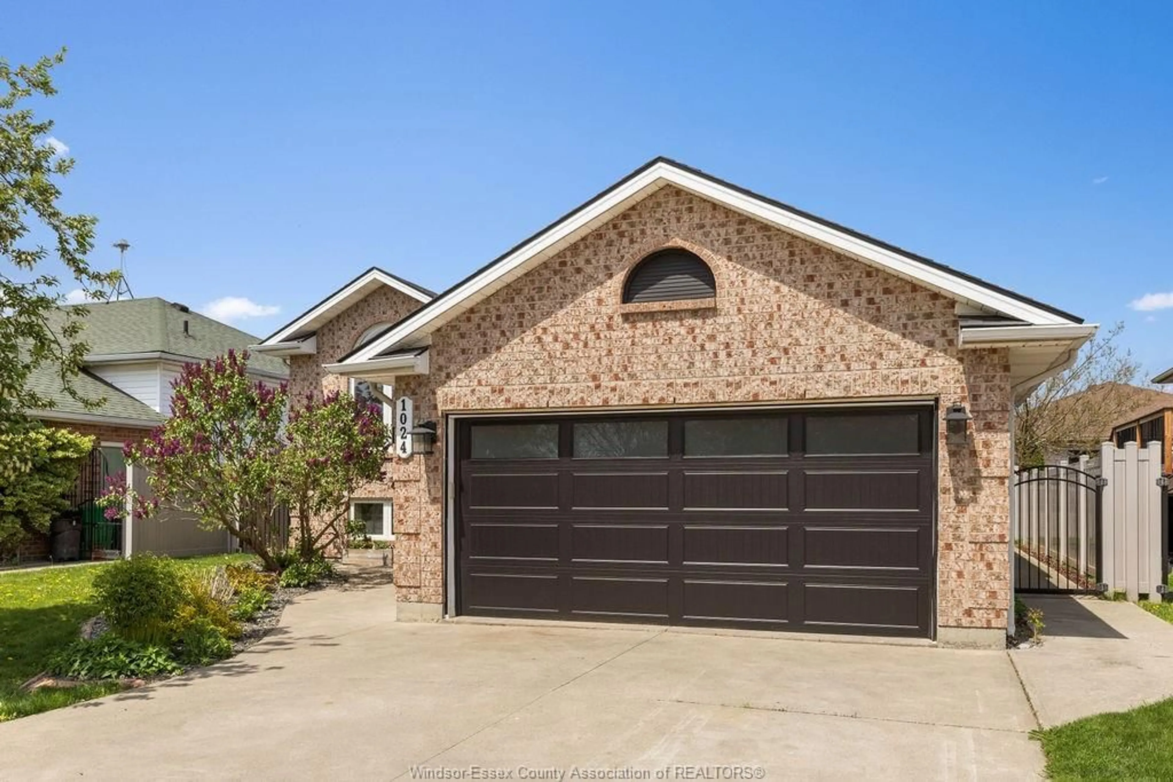 Home with brick exterior material, street for 1024 MONARCH MEADOWS Dr, Lakeshore Ontario N0R 1A0