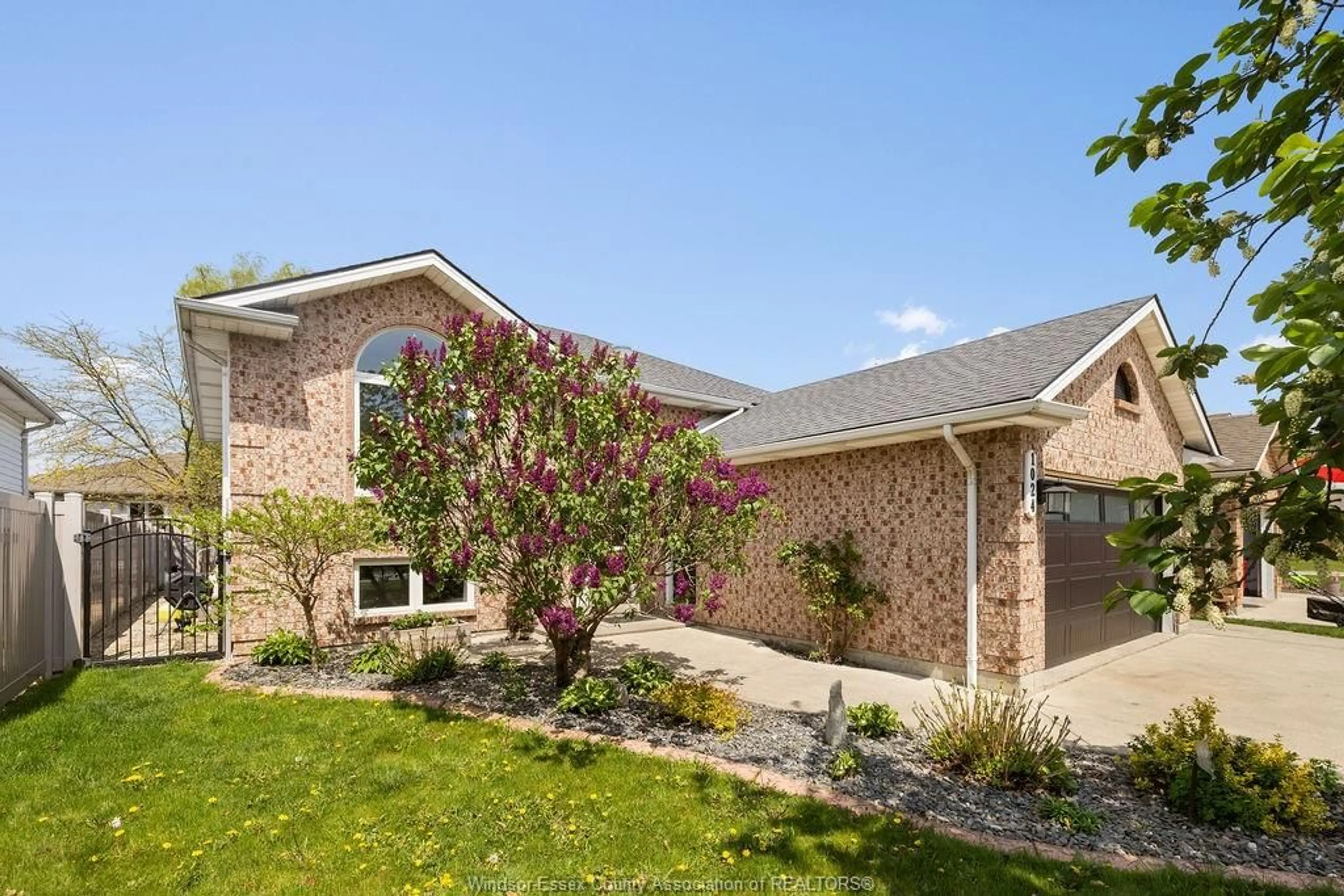 Home with brick exterior material, street for 1024 MONARCH MEADOWS Dr, Lakeshore Ontario N0R 1A0