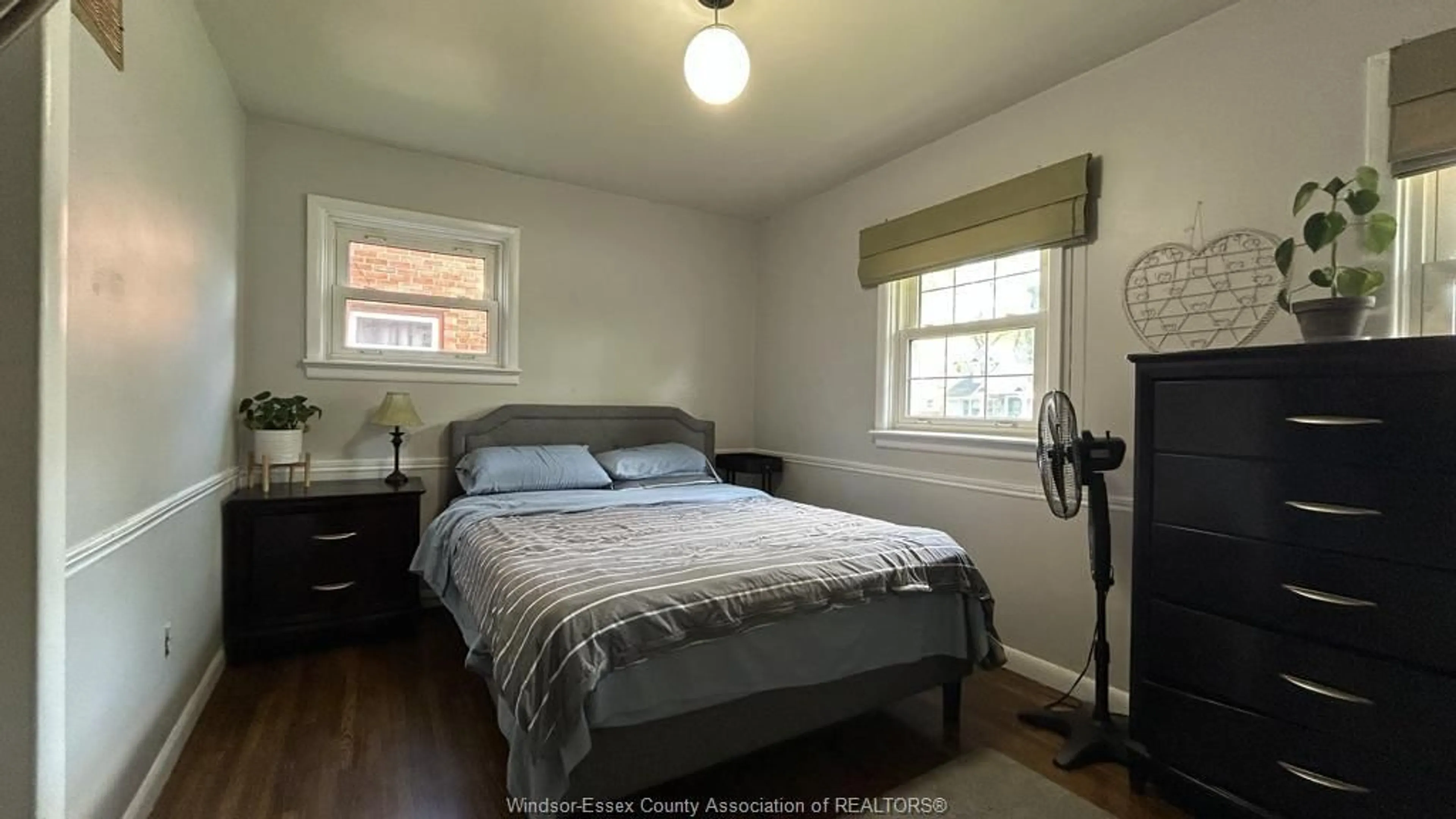 Bedroom with bed, wood/laminate floor for 1147 REEDMERE, Windsor Ontario N8R 2M2