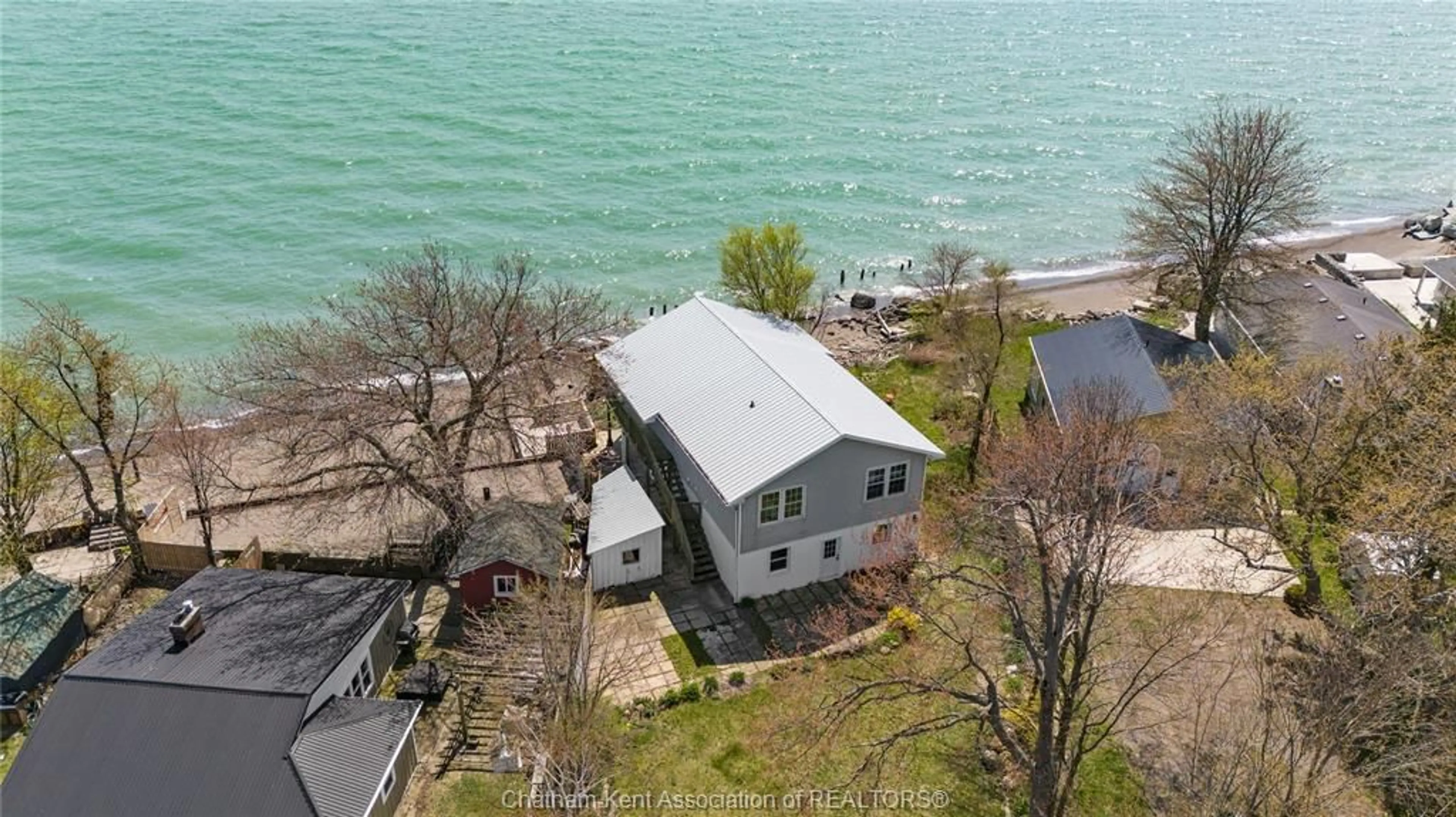 A pic from outside/outdoor area/front of a property/back of a property/a pic from drone, water/lake/river/ocean view for 18232 Erie Shore Dr, Blenheim Ontario N0P 1N0
