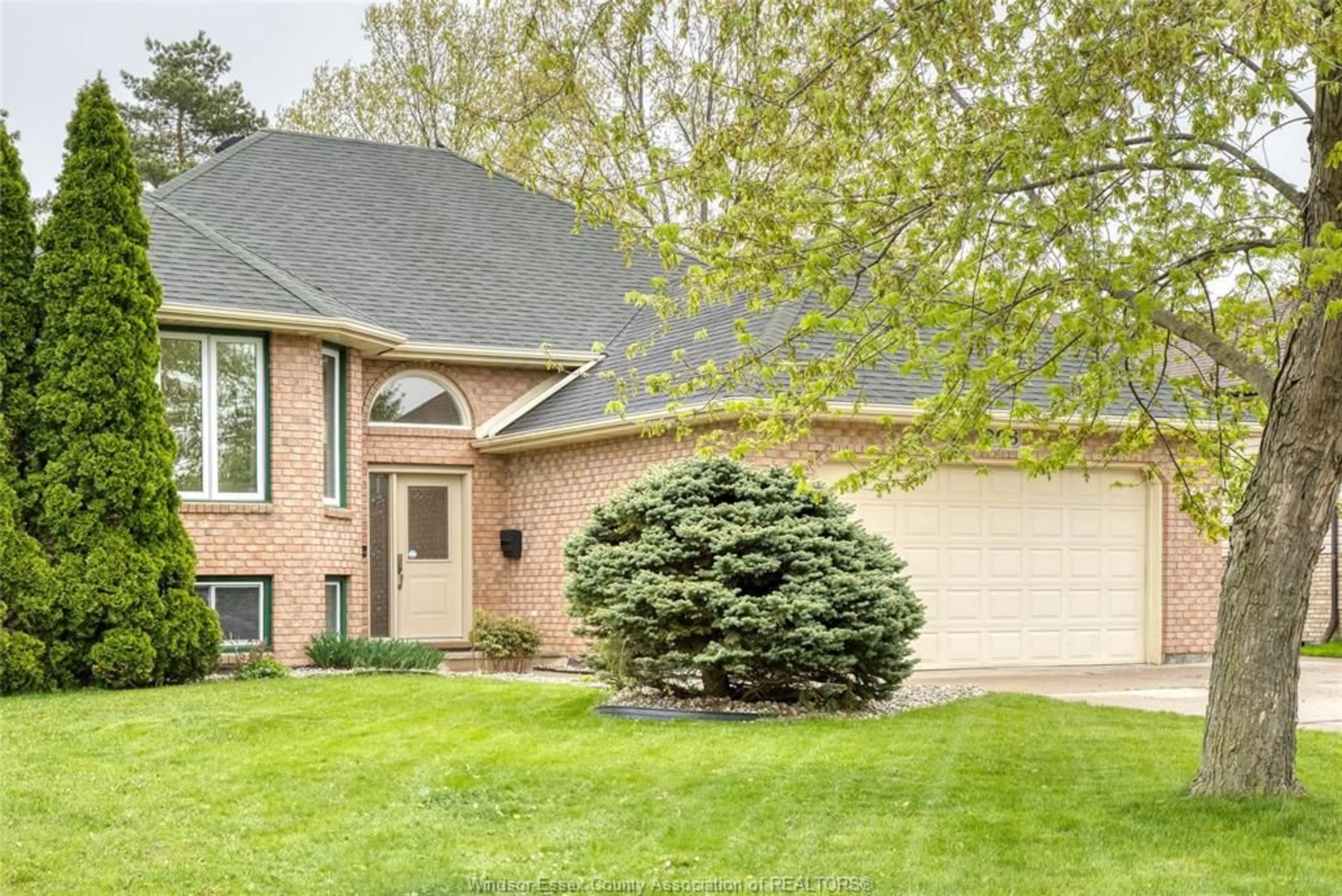Home with brick exterior material, street for 206 MAPLEWOOD Dr, Lakeshore Ontario N8L 1C2
