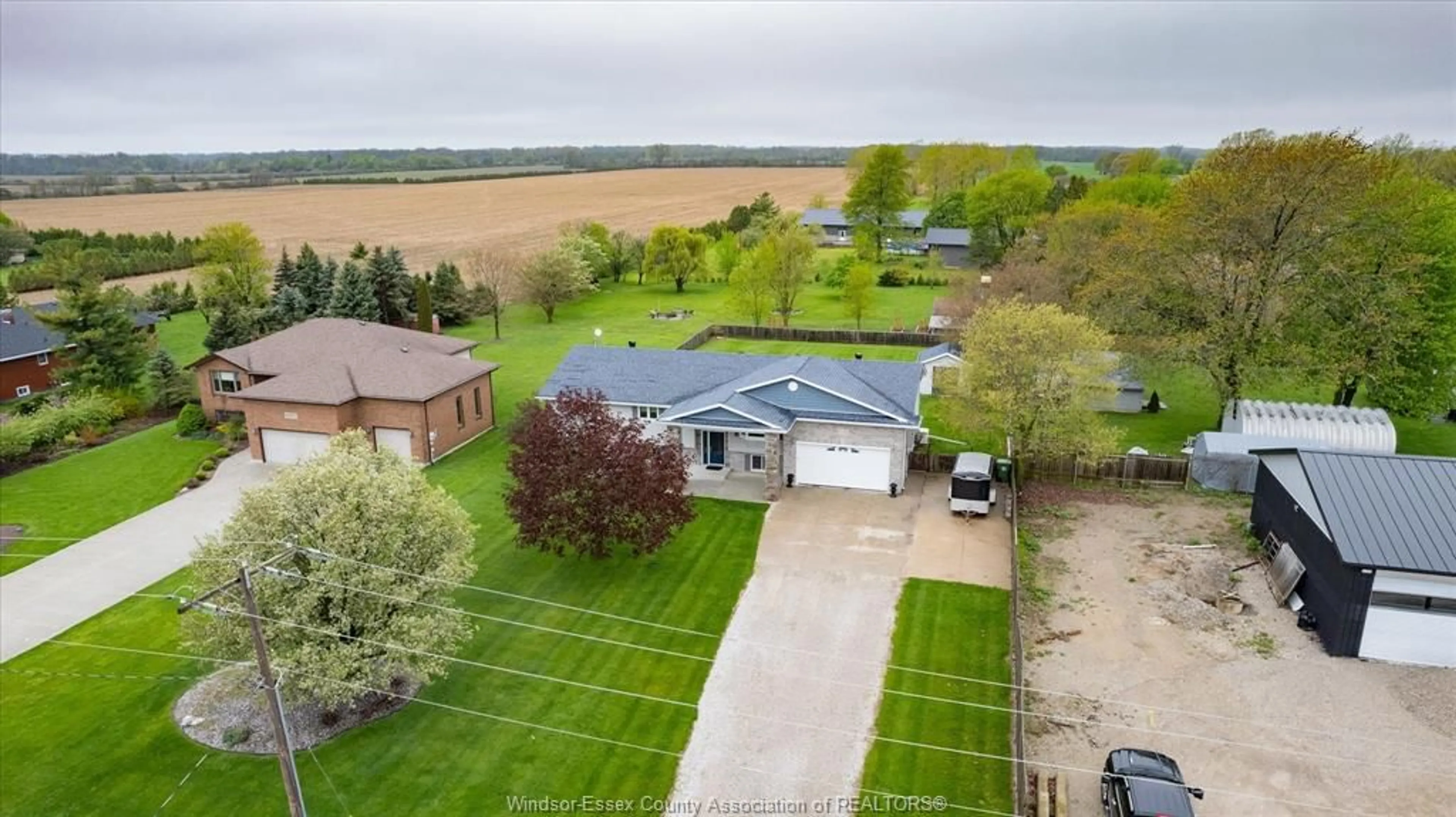 A pic from outside/outdoor area/front of a property/back of a property/a pic from drone, water/lake/river/ocean view for 6758 COUNTY RD 50, Amherstburg Ontario N0R 1G0