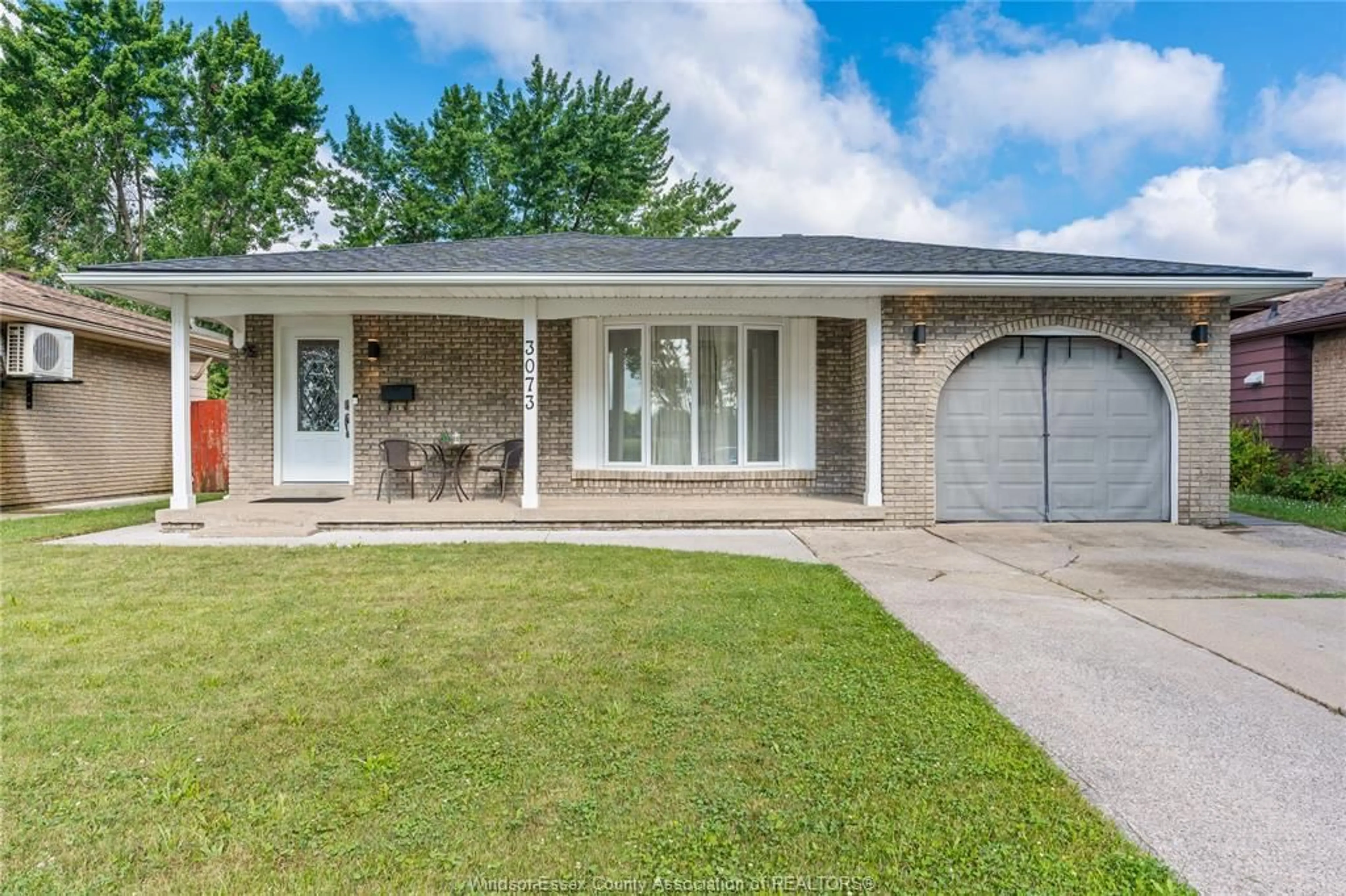 Home with brick exterior material, street for 3073 WILDWOOD Dr, Windsor Ontario N8R 1S7