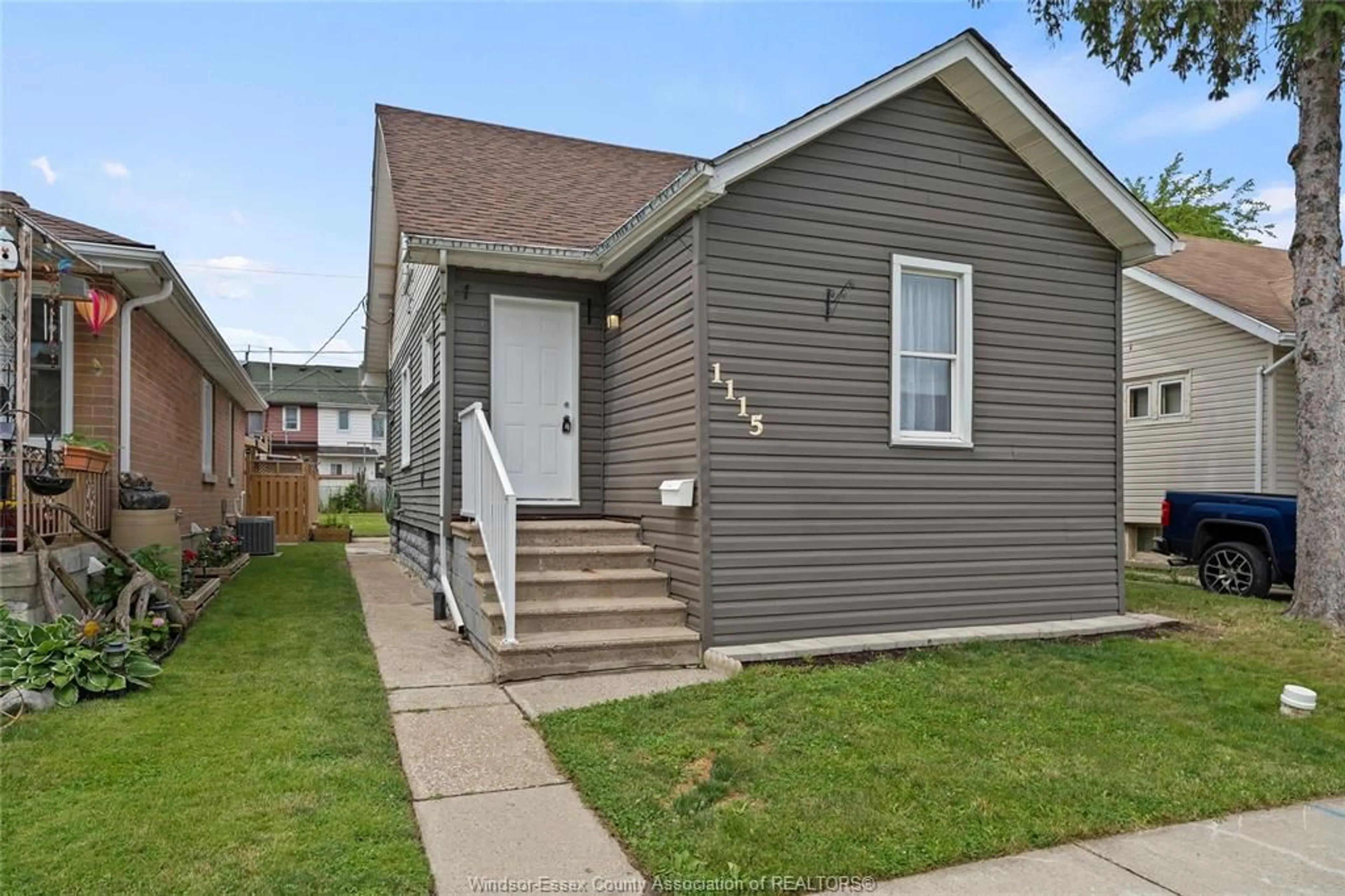 Home with vinyl exterior material, street for 1115 HIGHLAND Ave, Windsor Ontario N9A 1R6