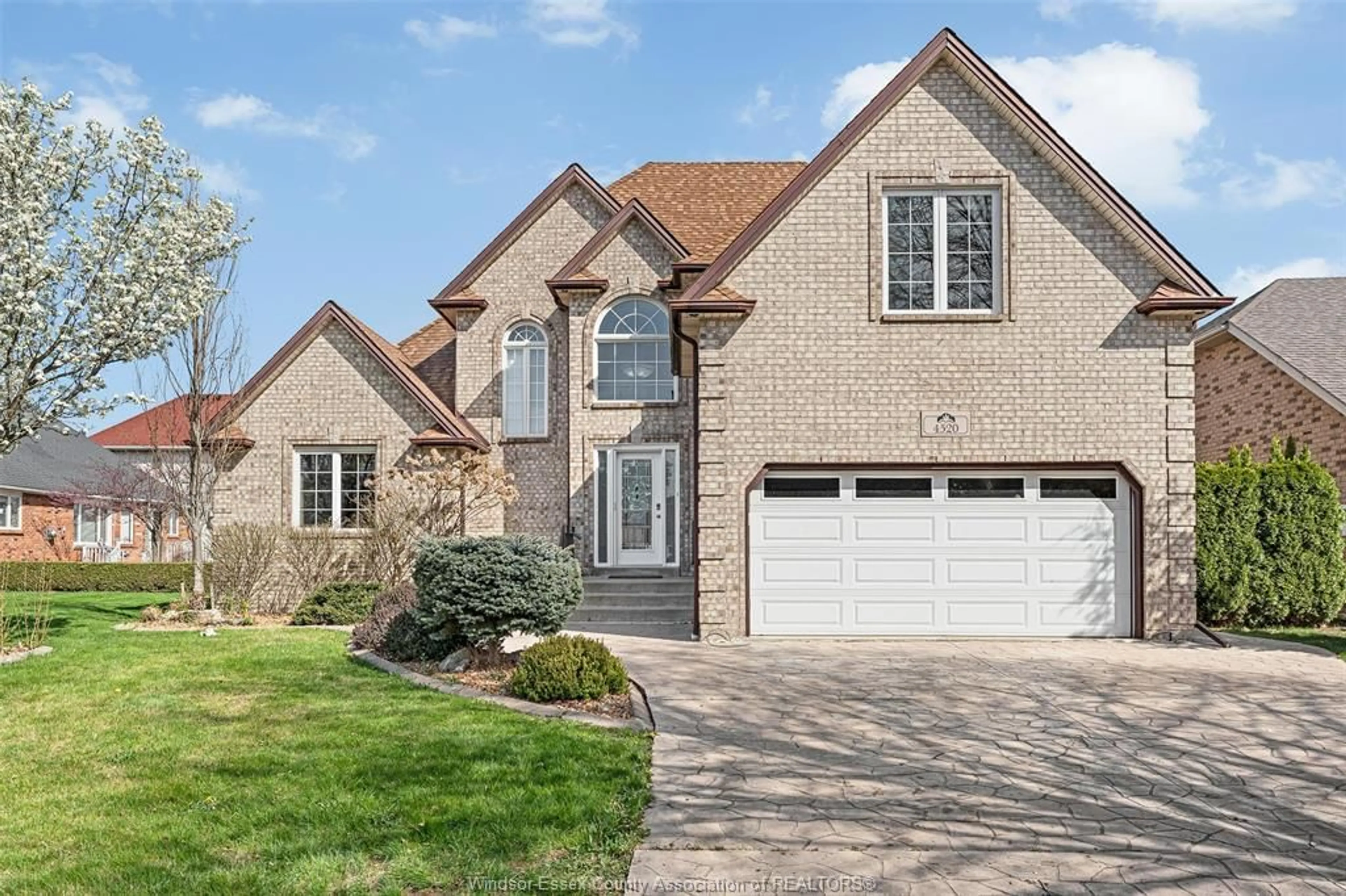 Home with brick exterior material, street for 4520 CENTRE LAKE Dr, Windsor Ontario N9G 2R1