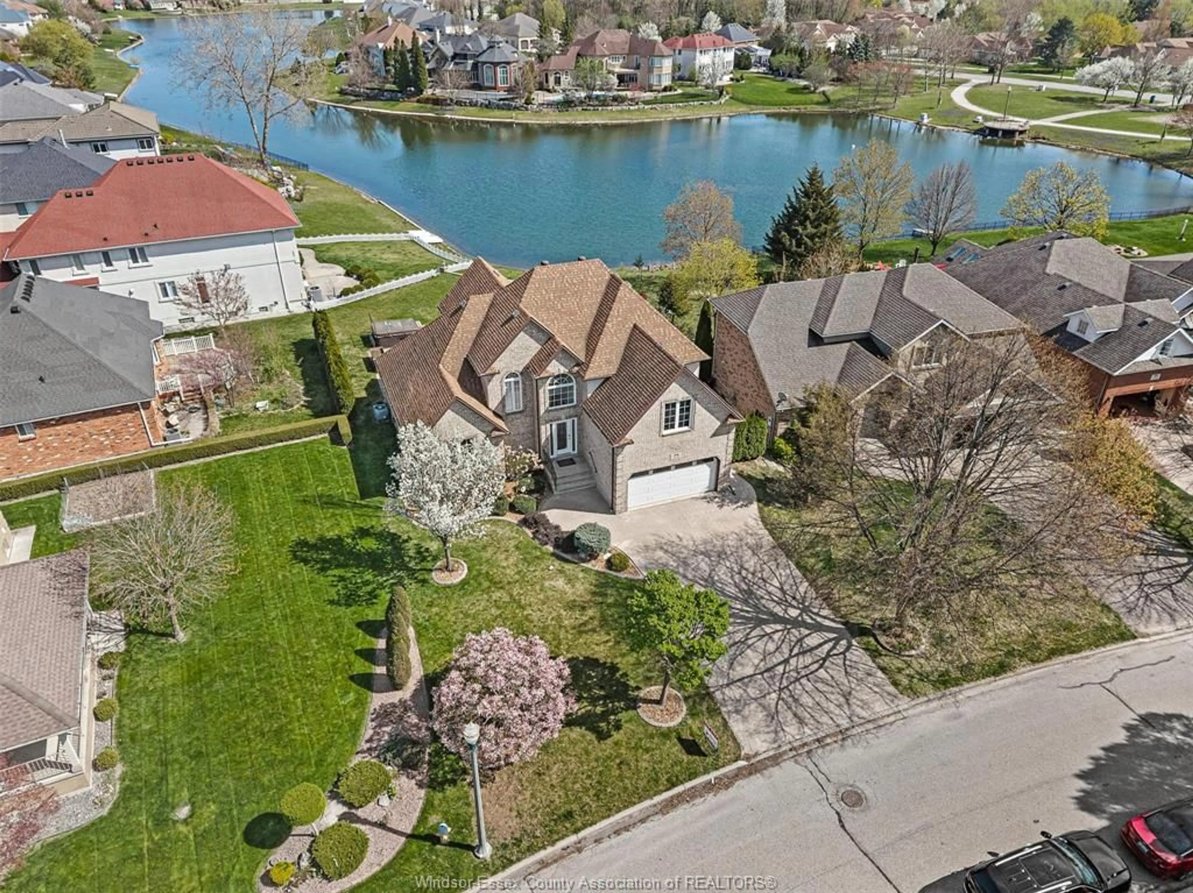 A pic from outside/outdoor area/front of a property/back of a property/a pic from drone, water/lake/river/ocean view for 4520 CENTRE LAKE Dr, Windsor Ontario N9G 2R1