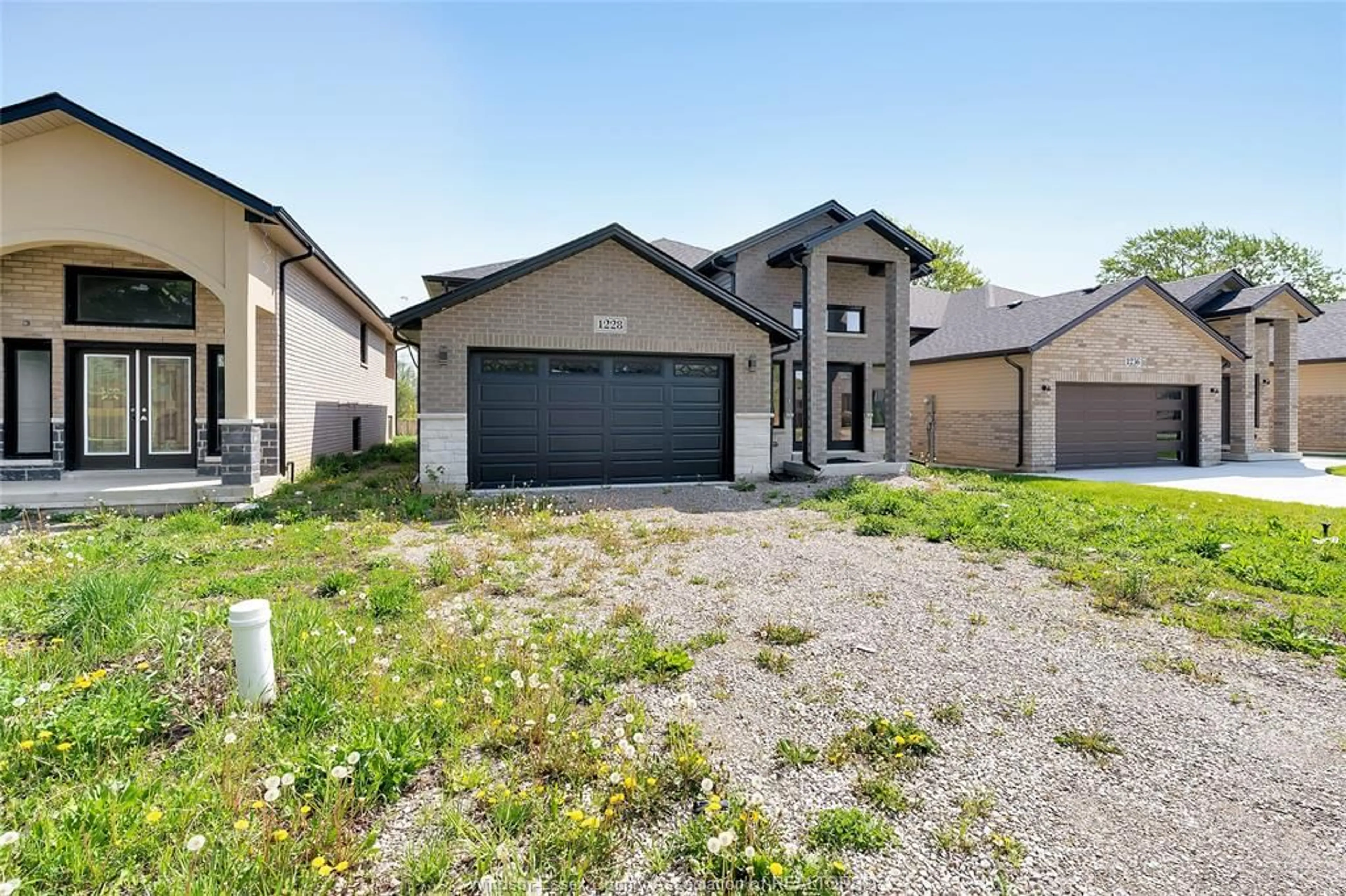Home with brick exterior material, street for 1228 TOURANGEAU, Windsor Ontario N8Y 0B2