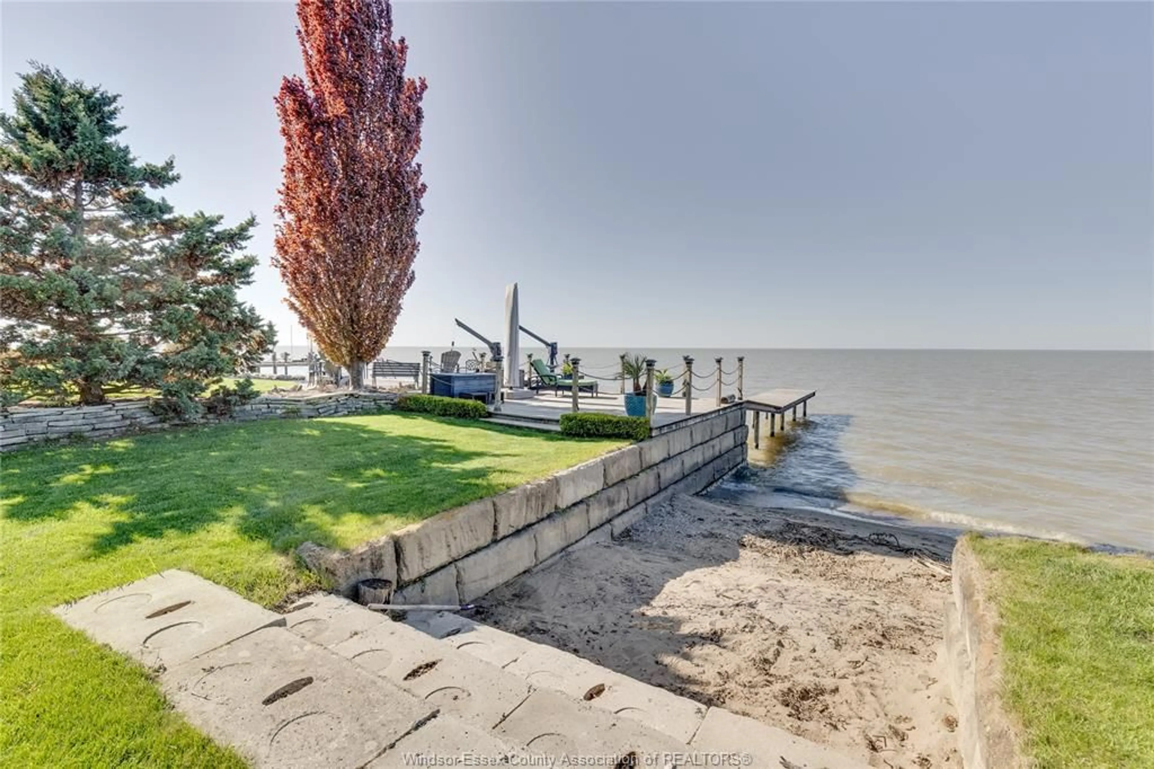 A pic from outside/outdoor area/front of a property/back of a property/a pic from drone, water/lake/river/ocean view for 677 Ross Beach, Lakeshore Ontario N8L 0H1