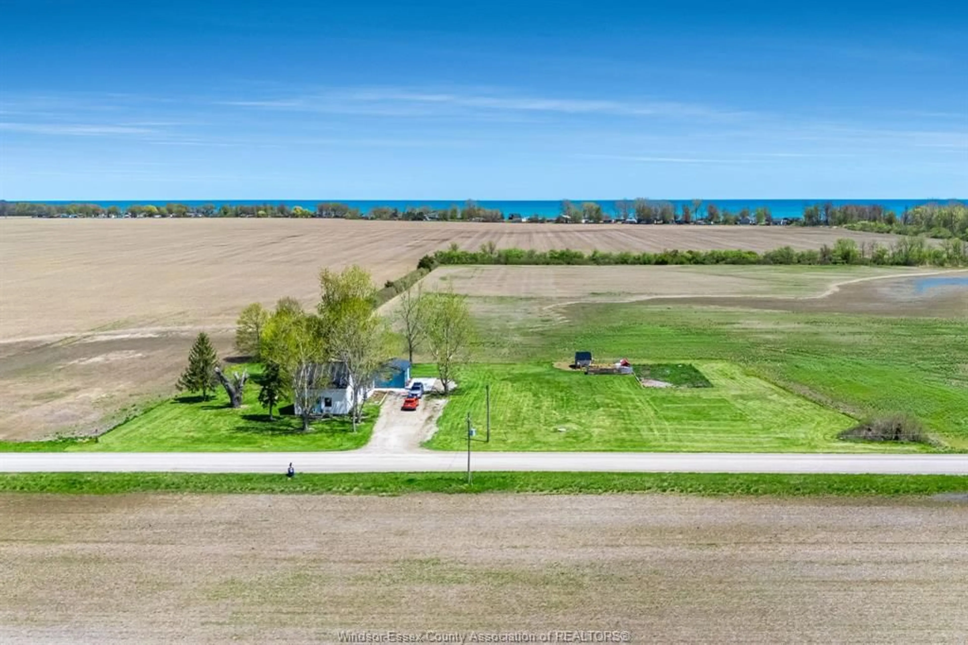 A pic from outside/outdoor area/front of a property/back of a property/a pic from drone, water/lake/river/ocean view for 242 Mersea Rd 21, Leamington Ontario N8H 3V7