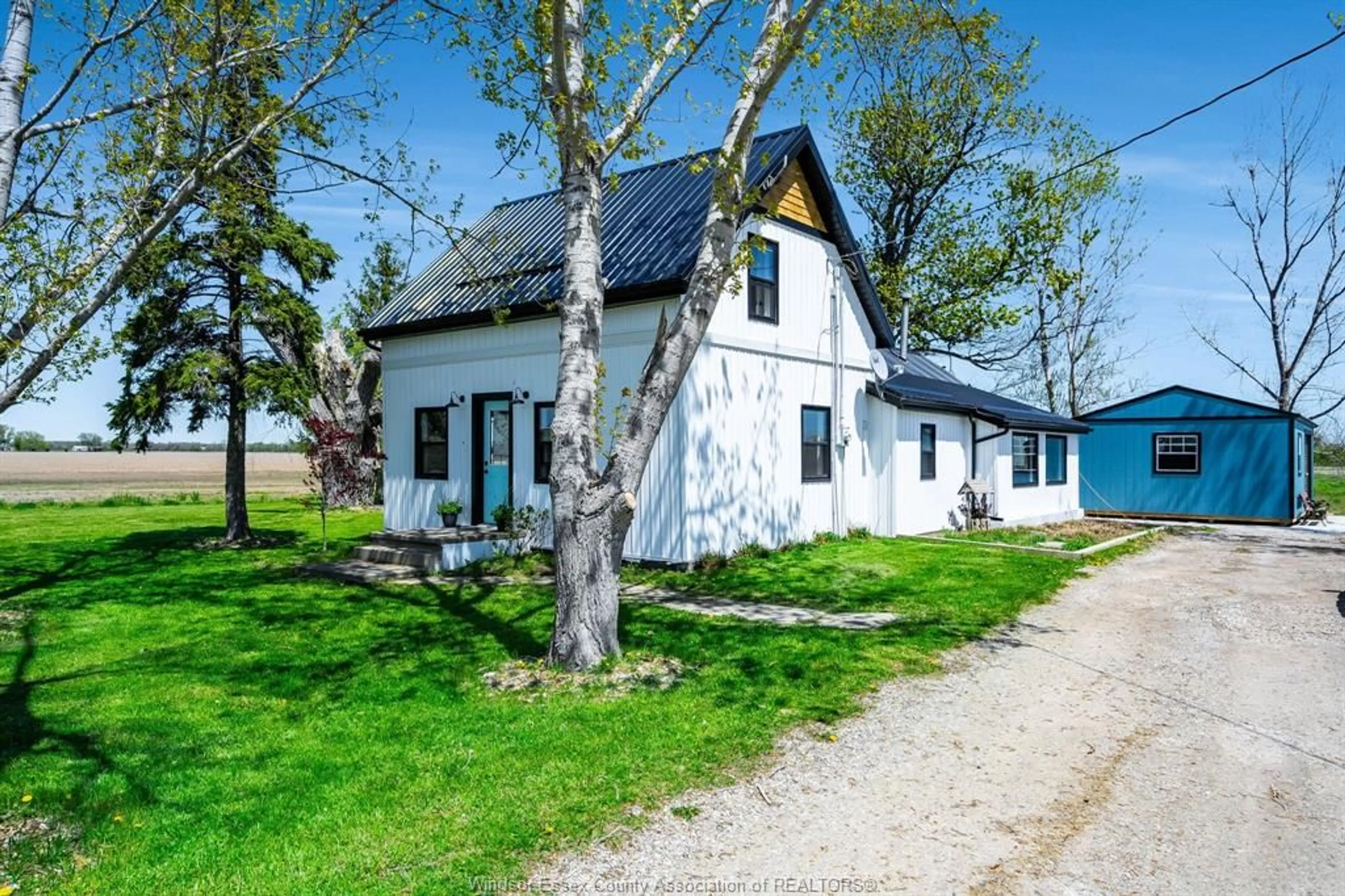 A pic from outside/outdoor area/front of a property/back of a property/a pic from drone, street for 242 Mersea Rd 21, Leamington Ontario N8H 3V7