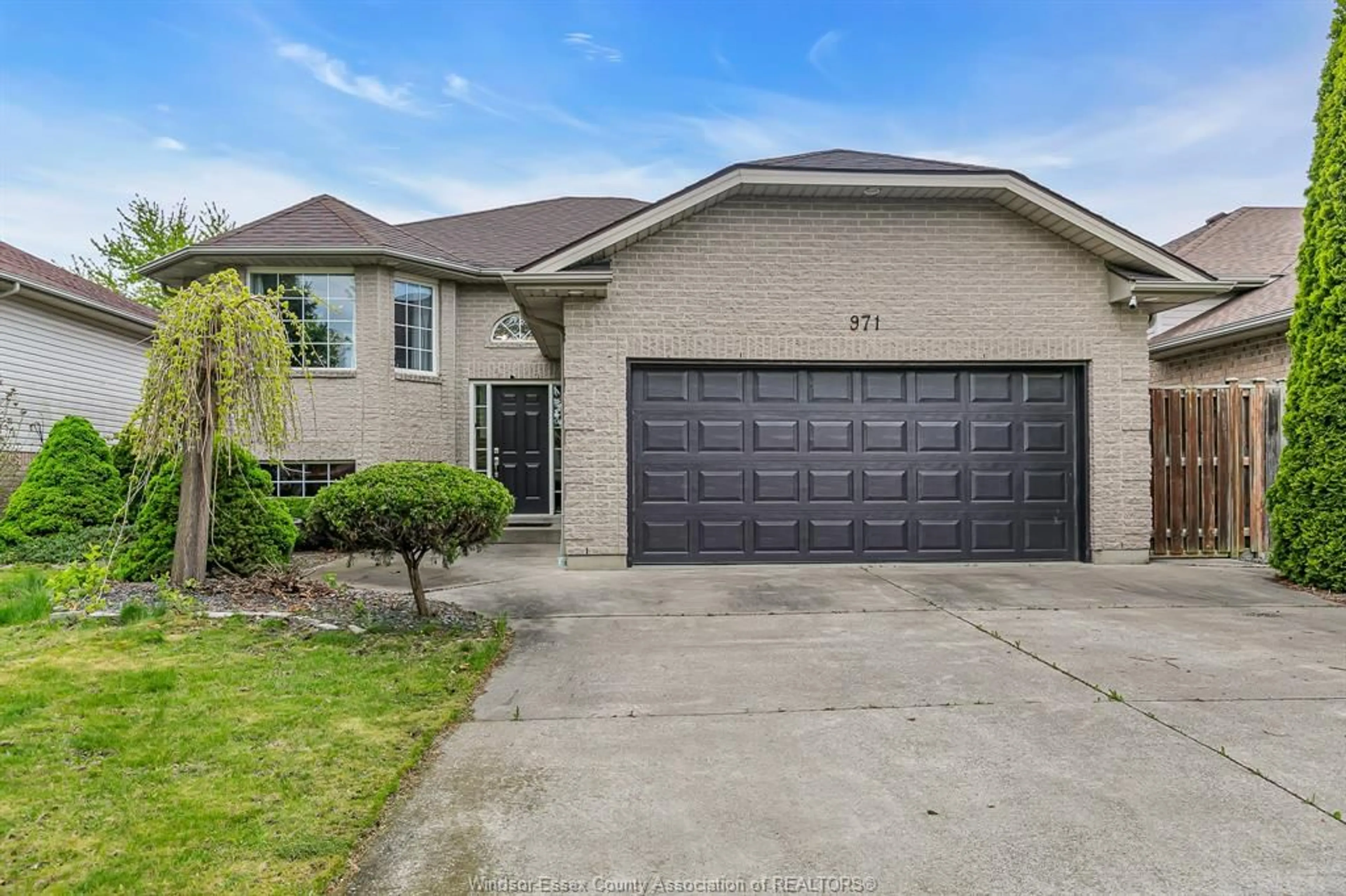 Home with brick exterior material, street for 971 BELLAGIO Dr, Windsor Ontario N8P 1J7