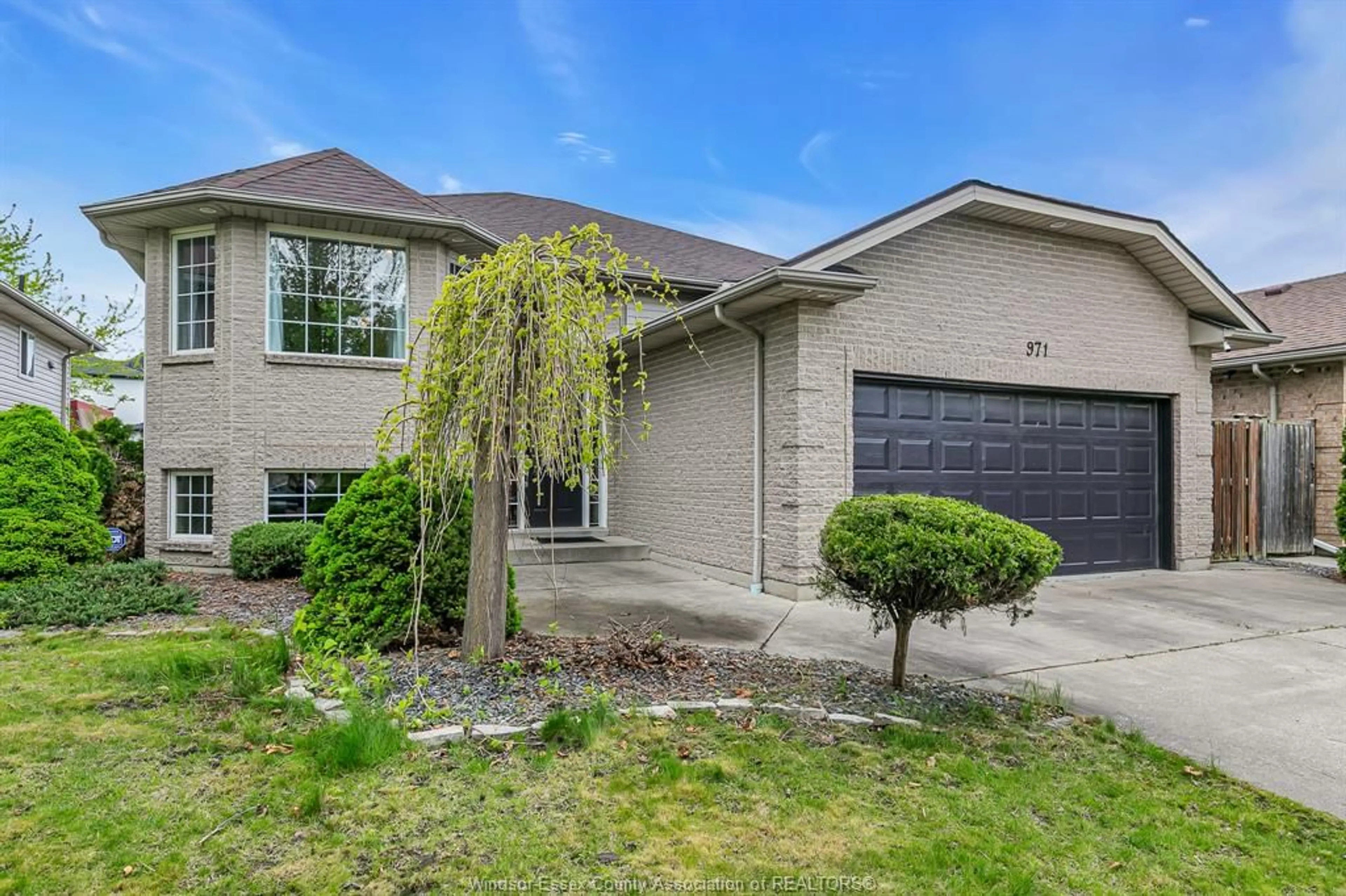 Home with brick exterior material, street for 971 BELLAGIO Dr, Windsor Ontario N8P 1J7