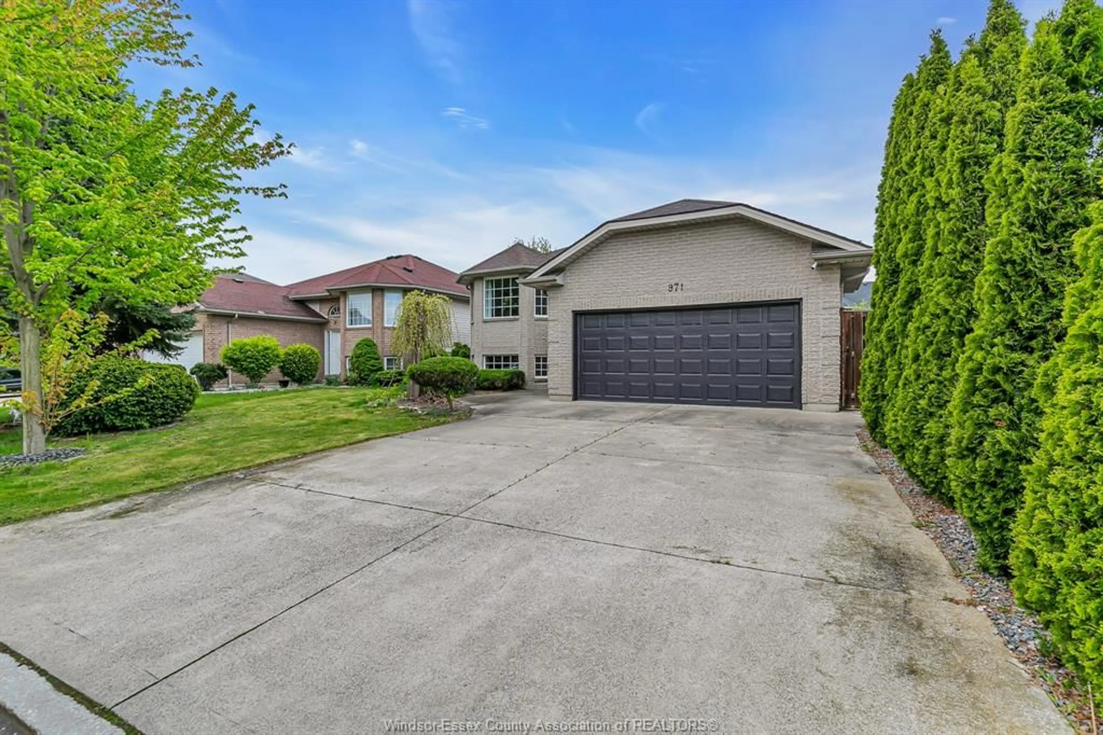 A pic from outside/outdoor area/front of a property/back of a property/a pic from drone, street for 971 BELLAGIO Dr, Windsor Ontario N8P 1J7