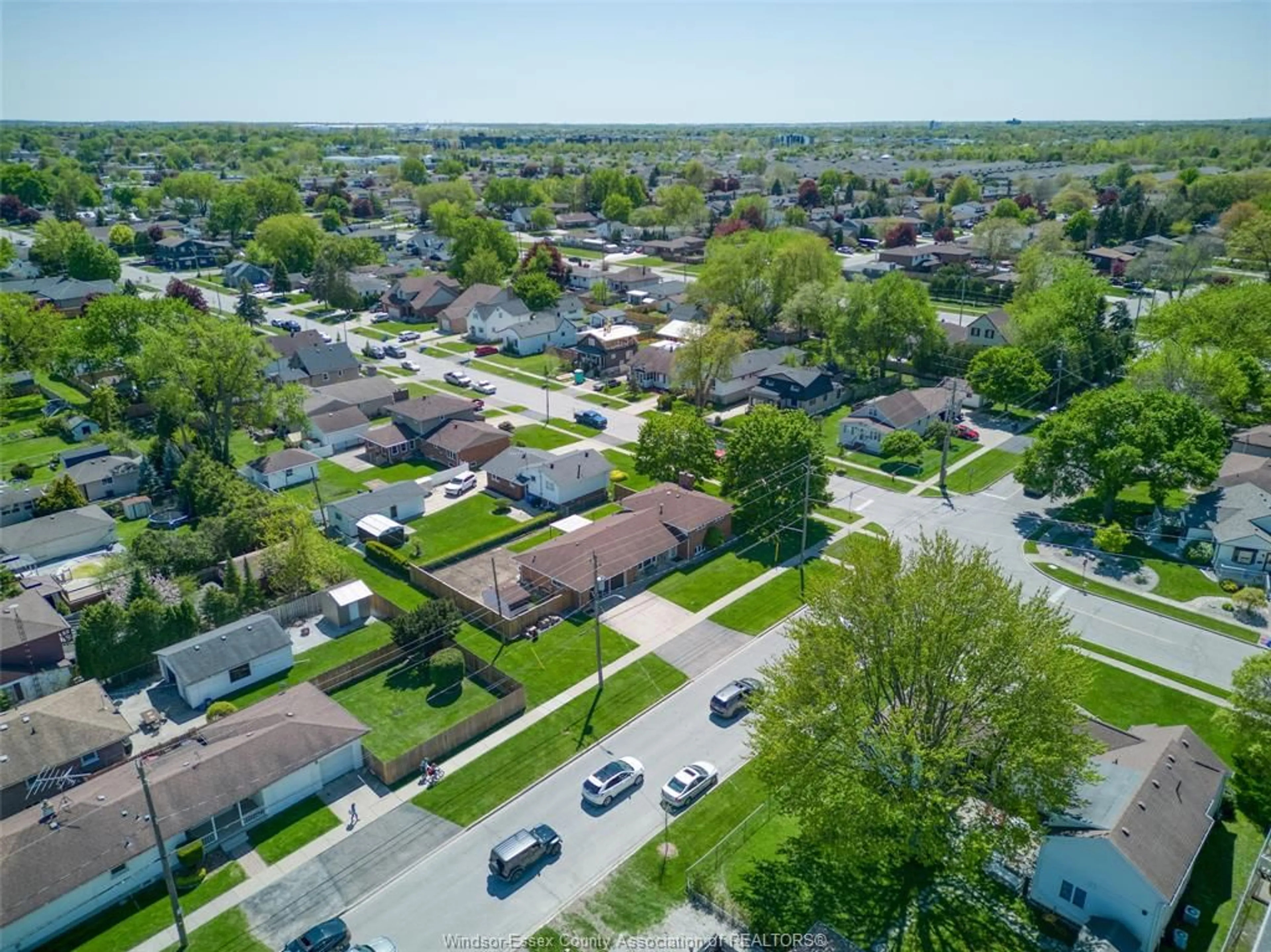 A pic from outside/outdoor area/front of a property/back of a property/a pic from drone, street for 12351 CLAPP St, Tecumseh Ontario N8N 1H2