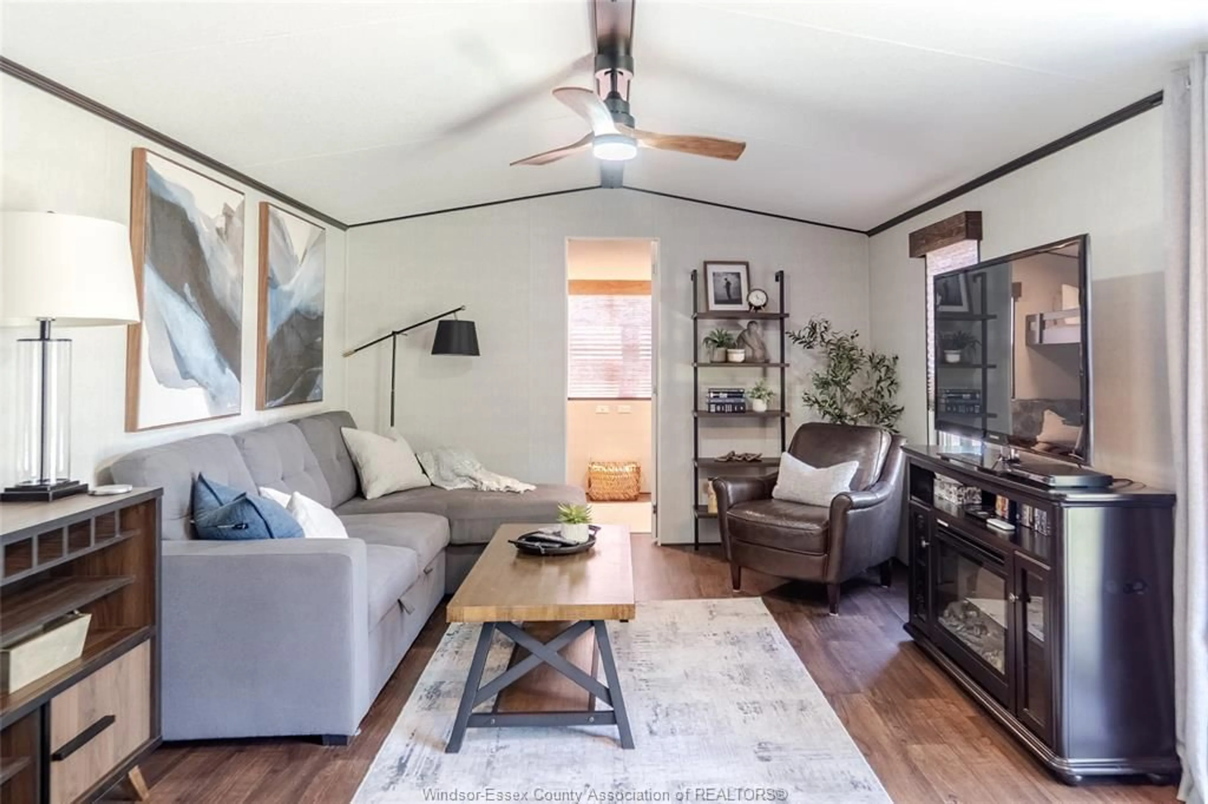 Living room with furniture, wood/laminate floor for 981 COUNTY ROAD 2 #537, Lakeshore Ontario N0R 1A0